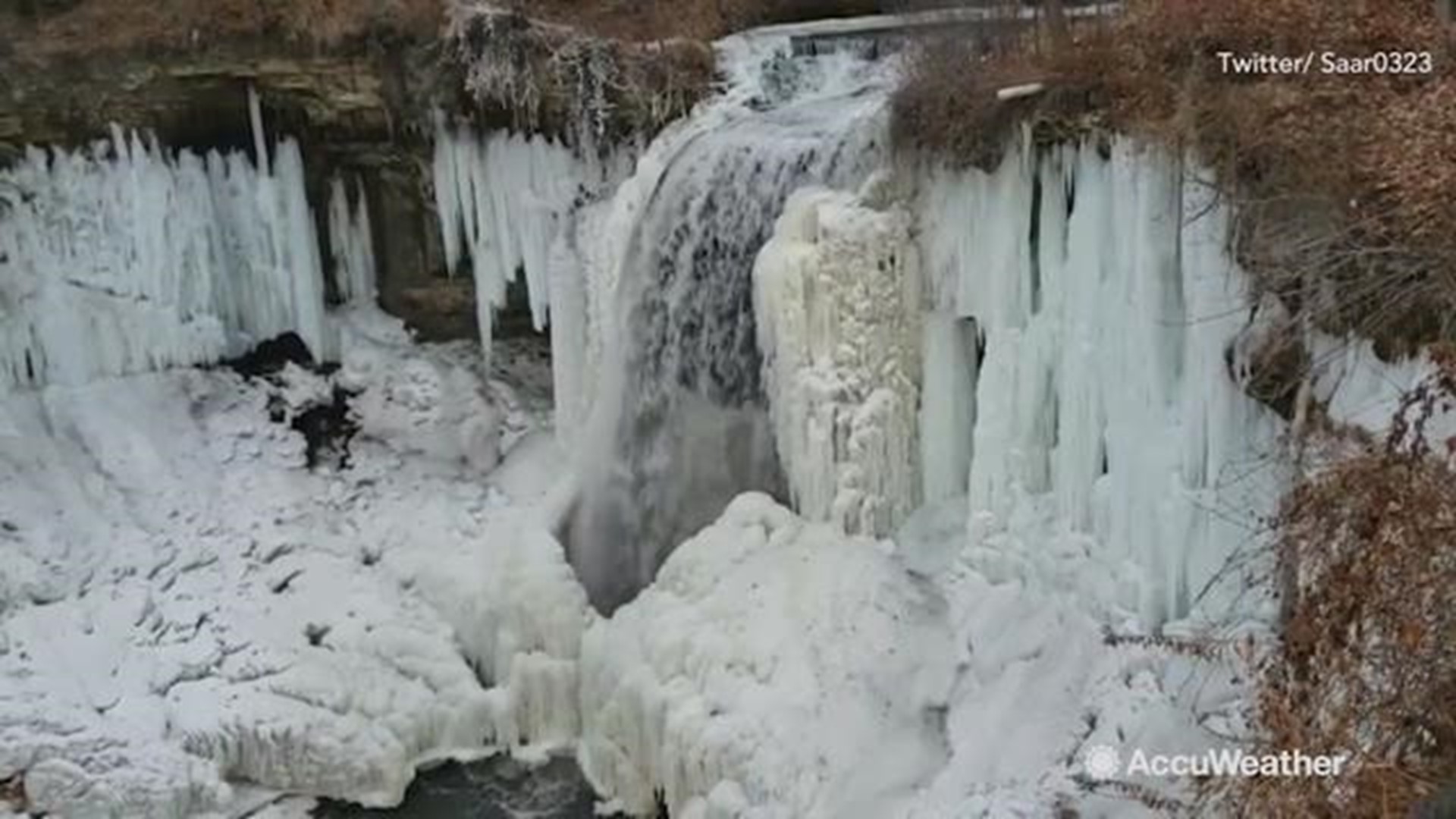 Incredible view of the Minnehaha Falls in Minneapolis, Minnesota. Part of the waterfall is frozen, adding to its beauty.