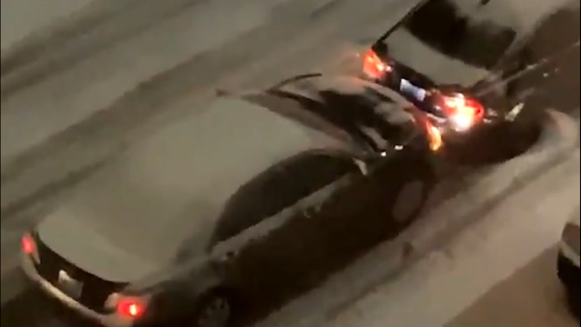 A car was seen trying to push another car up a snowy hill in Seattle, Washington, in the early morning hours of Feb. 13.