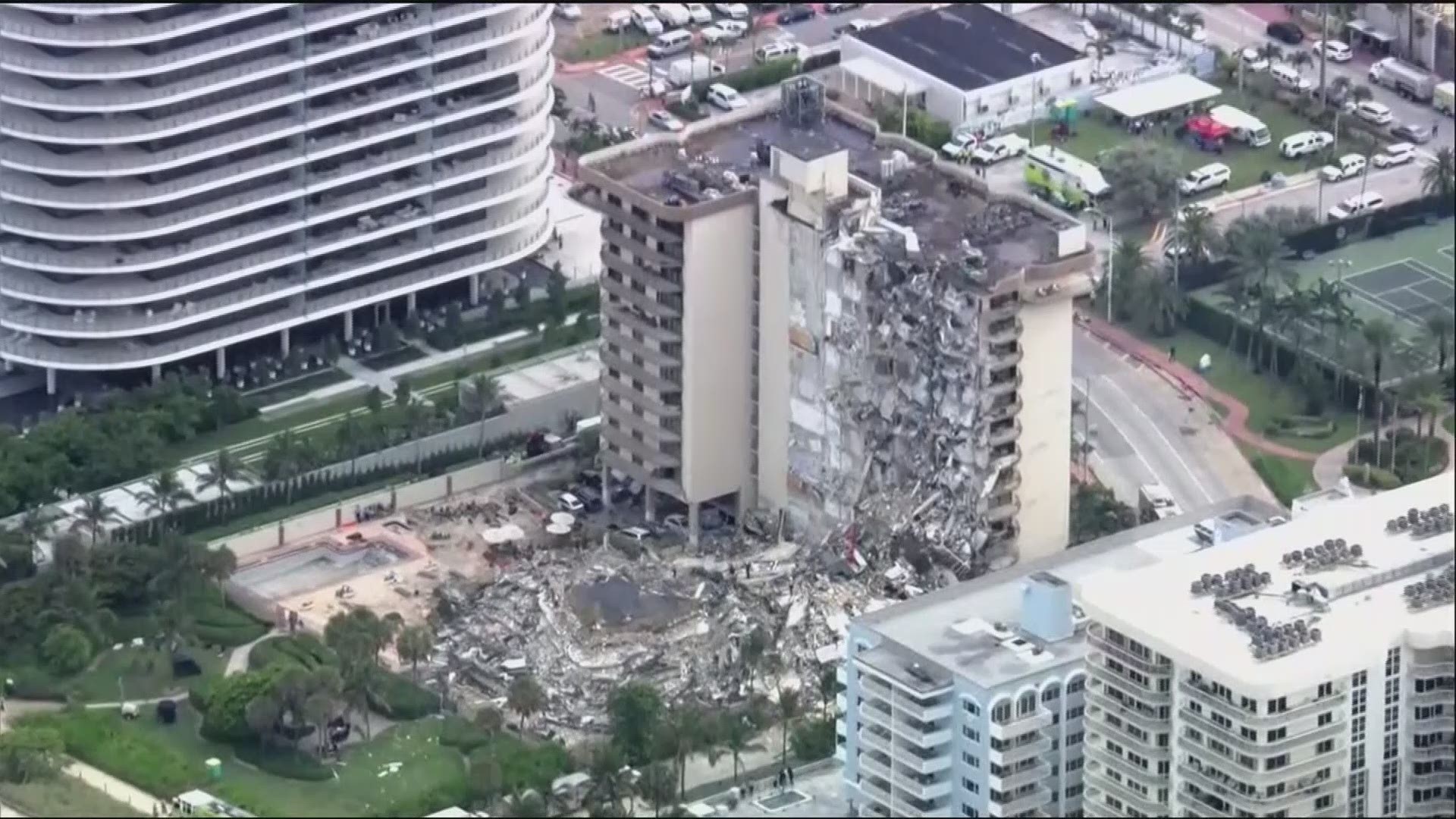 Rescue workers are using dogs in a search for survivors in the twisted wreckage of a Miami-area condo building.