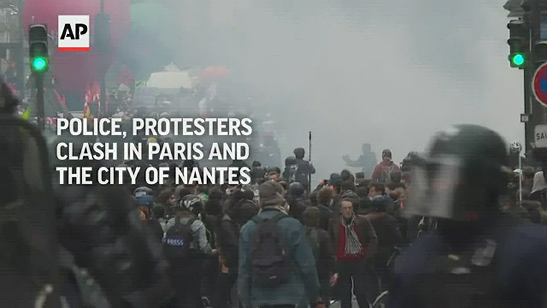 Police fired tear gas at protesters in Paris where crowds took to the streets in the first mass demonstrations since President Macron announced pension changes.