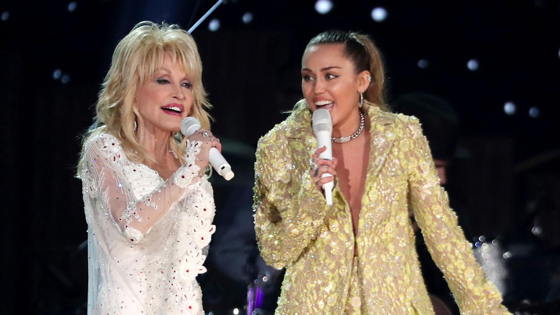 Miley Cyrus pays tribute to godmother Dolly Parton, wipes away tears during Hollywood Bowl concert