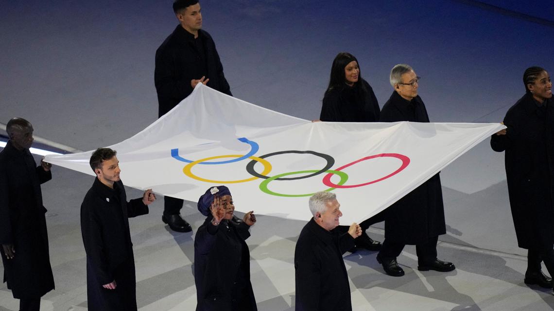 Tonga's viral shirtless flag bearer back for 2026 Opening Ceremony, but wore a jacket