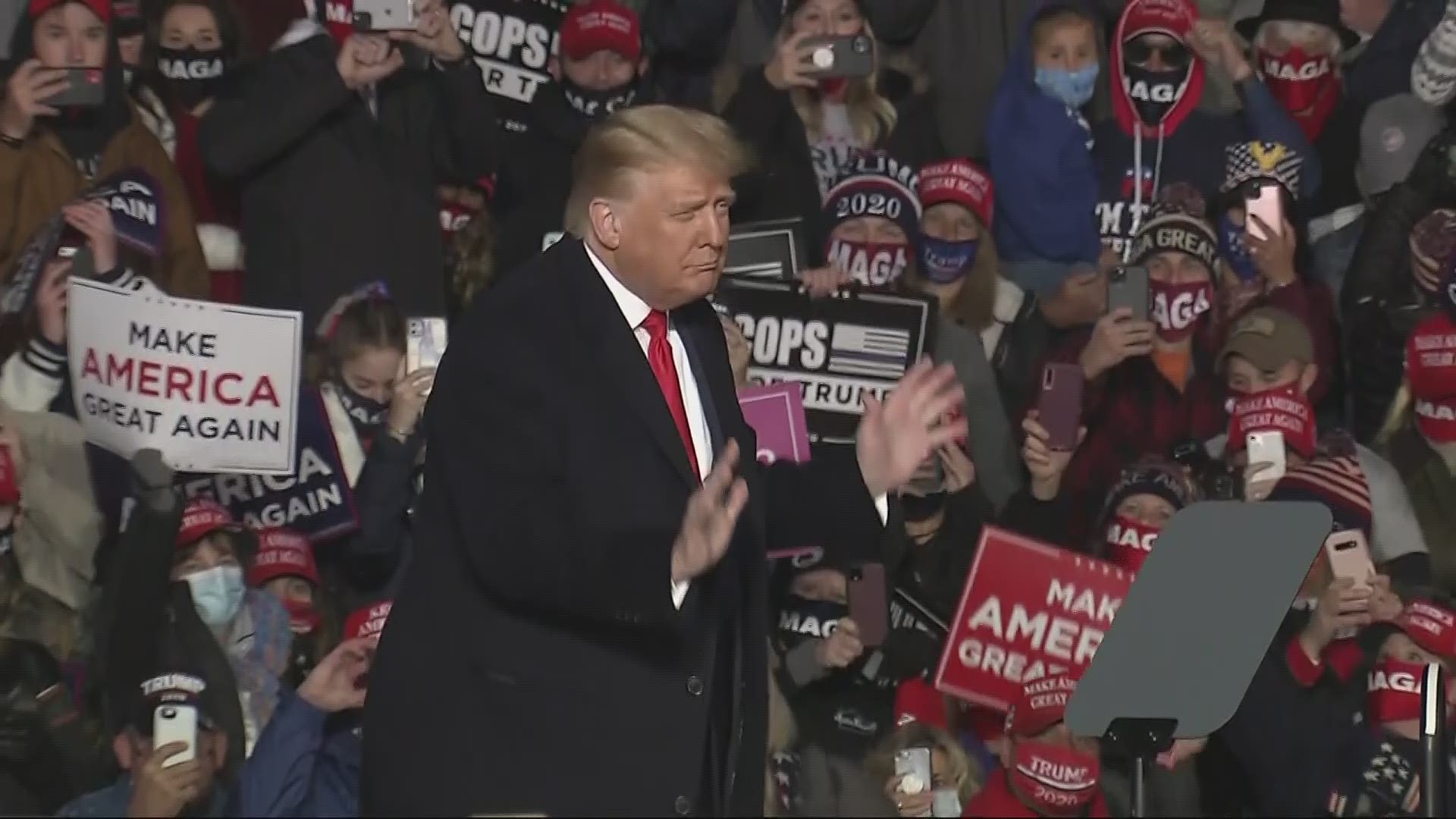 President Donald Trump dances to "YMCA" at the end of his rally in Erie, Pennsylvania, Oct. 20, 2020.