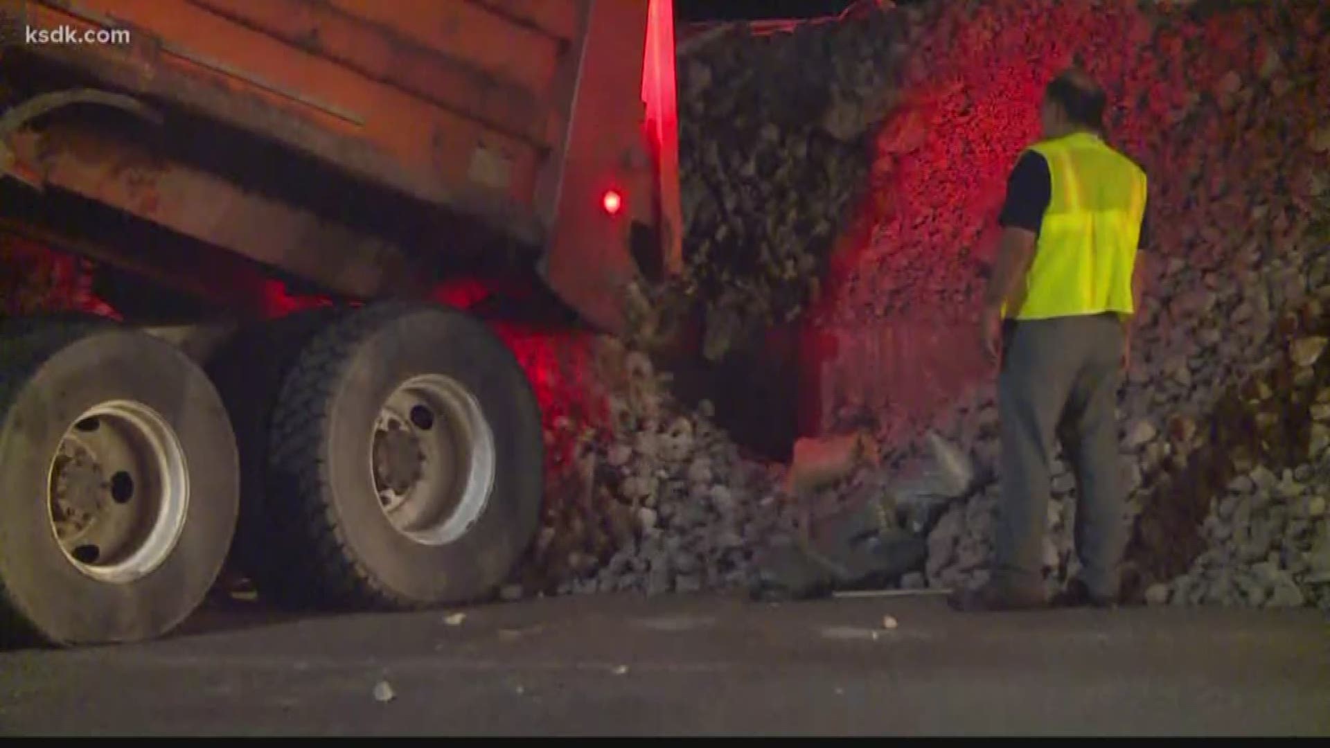 Emergency crews were along the River Des Peres early Friday morning after water began leaking onto the street in the Carondolet neighborhood. Several dump trucks filled with gravel lined Carondelet Boulevard as a front loader piled additional sandbags and gravel along the wall.