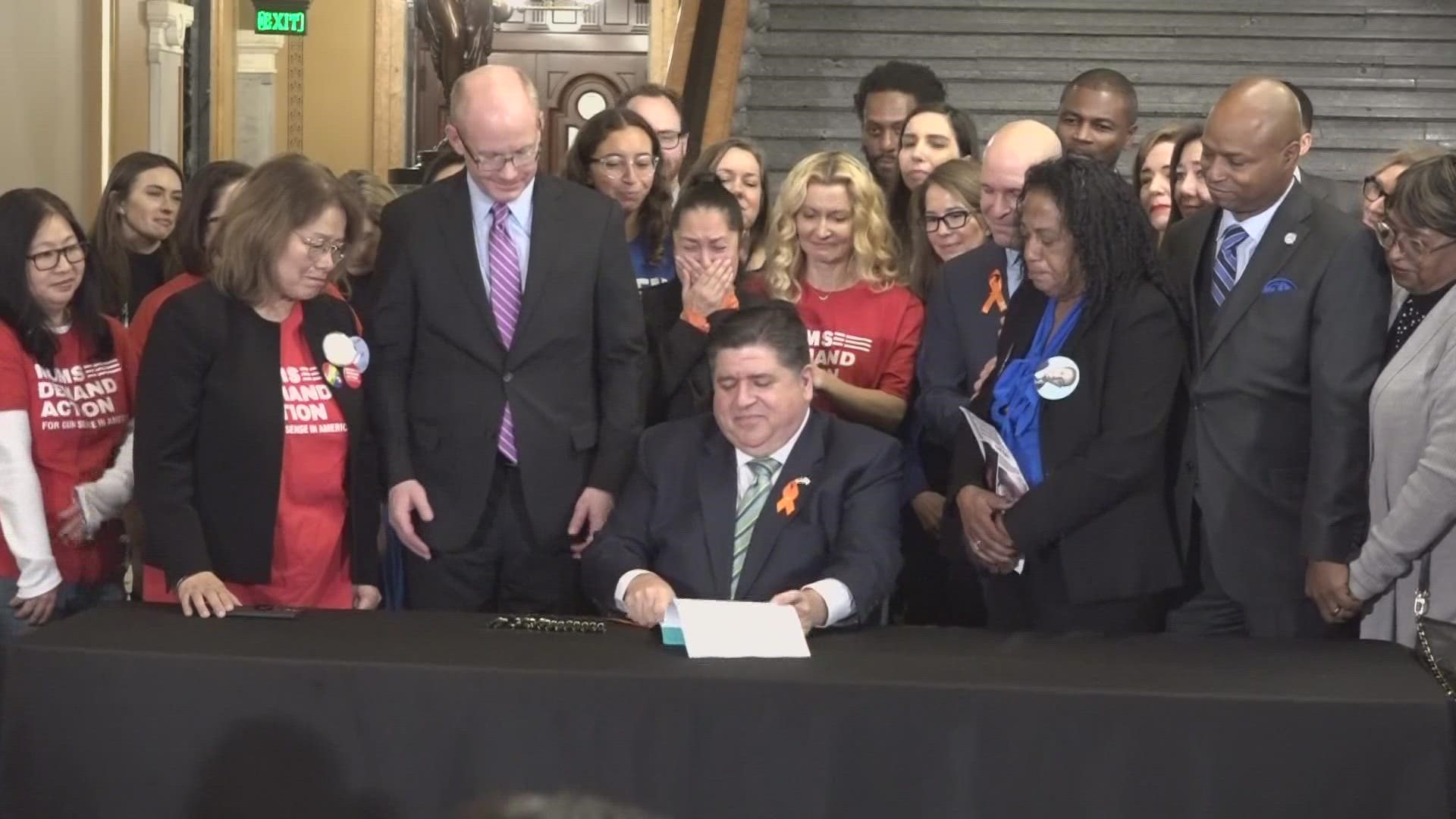 Pritzker signed the bill while flanked by Illinois congressional Democrats and gun control advocates from around the state.