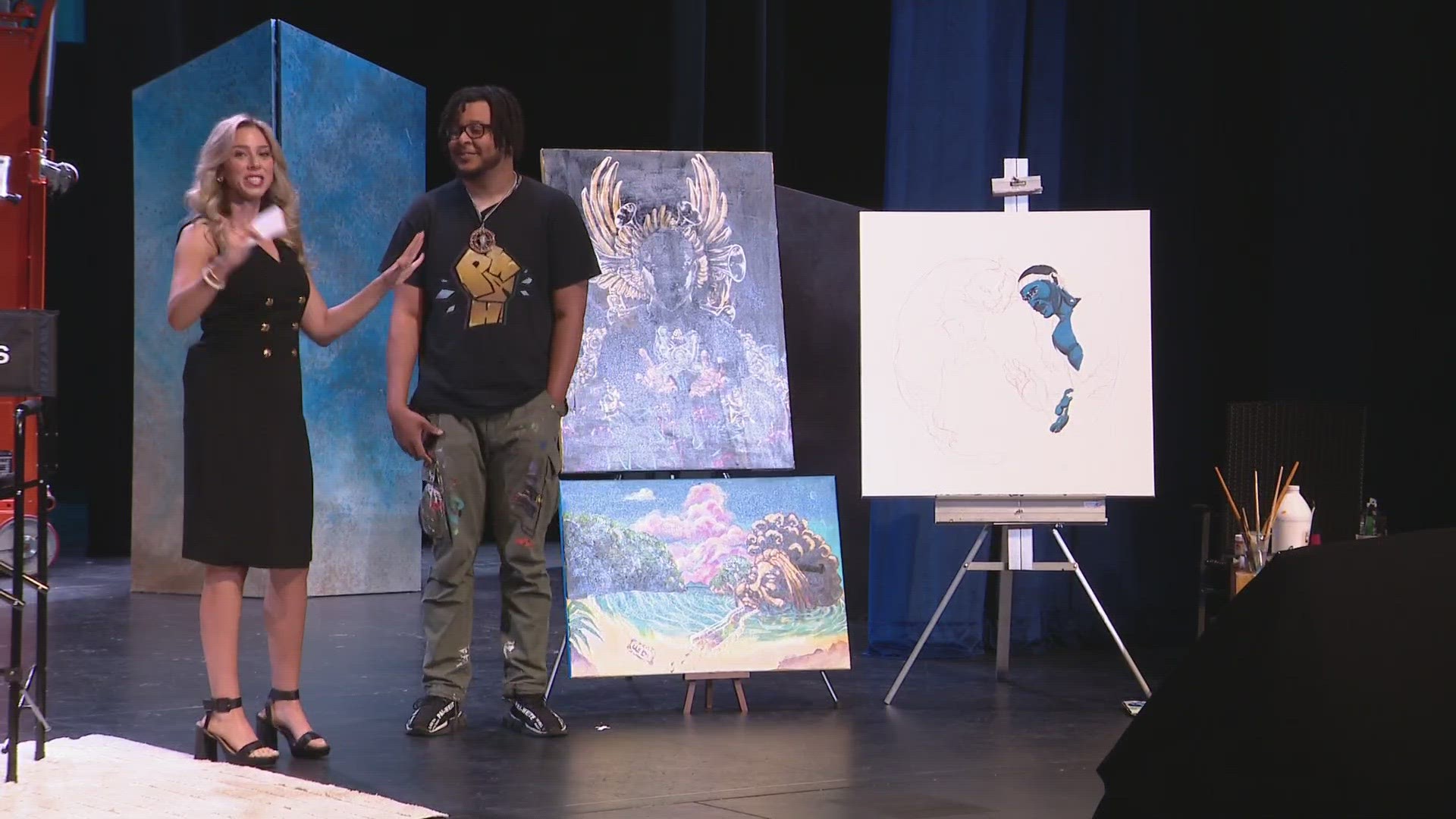 Tyler Harris, aka E7tash, joins Mary onstage with a live painting demonstration