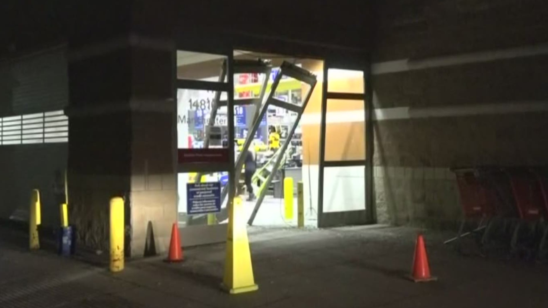 Police said surveillance footage showed the thieves backing the SUV through the store's glass sliding doors