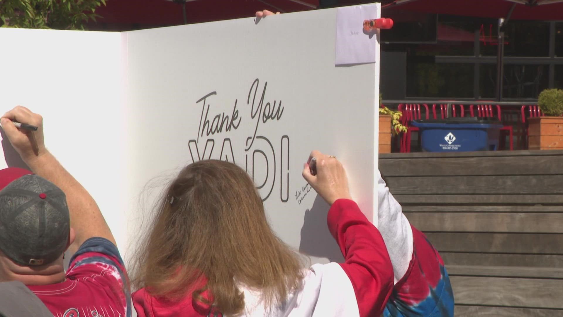 Cards fans can sign giant greeting cards for the retiring players. Albert Pujols and Yadier Molina are signing off but fans can say "thank you."
