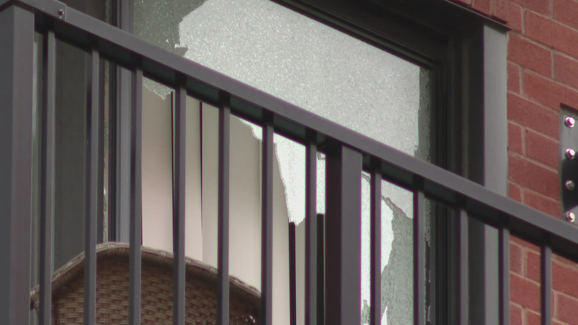 A bullet hit a glass door at 11th and Spruce Apartments, raising safety concerns.