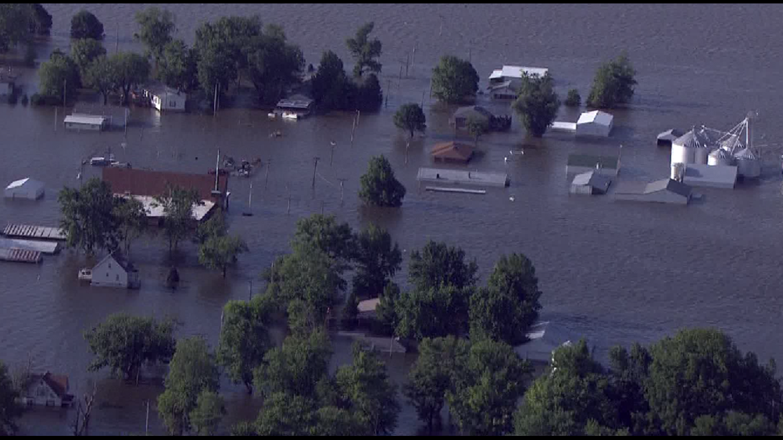 West Alton man rescued from home by boat after trying to ride out ...