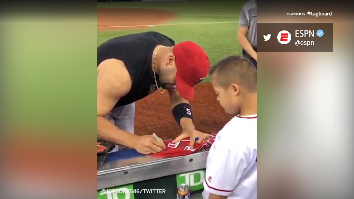 MLB News  Albert Pujols gives young fan his jersey and signs it
