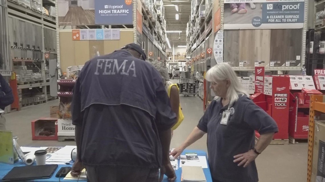 FEMA officials set up tables at local Home Depot locations, helping flood victims