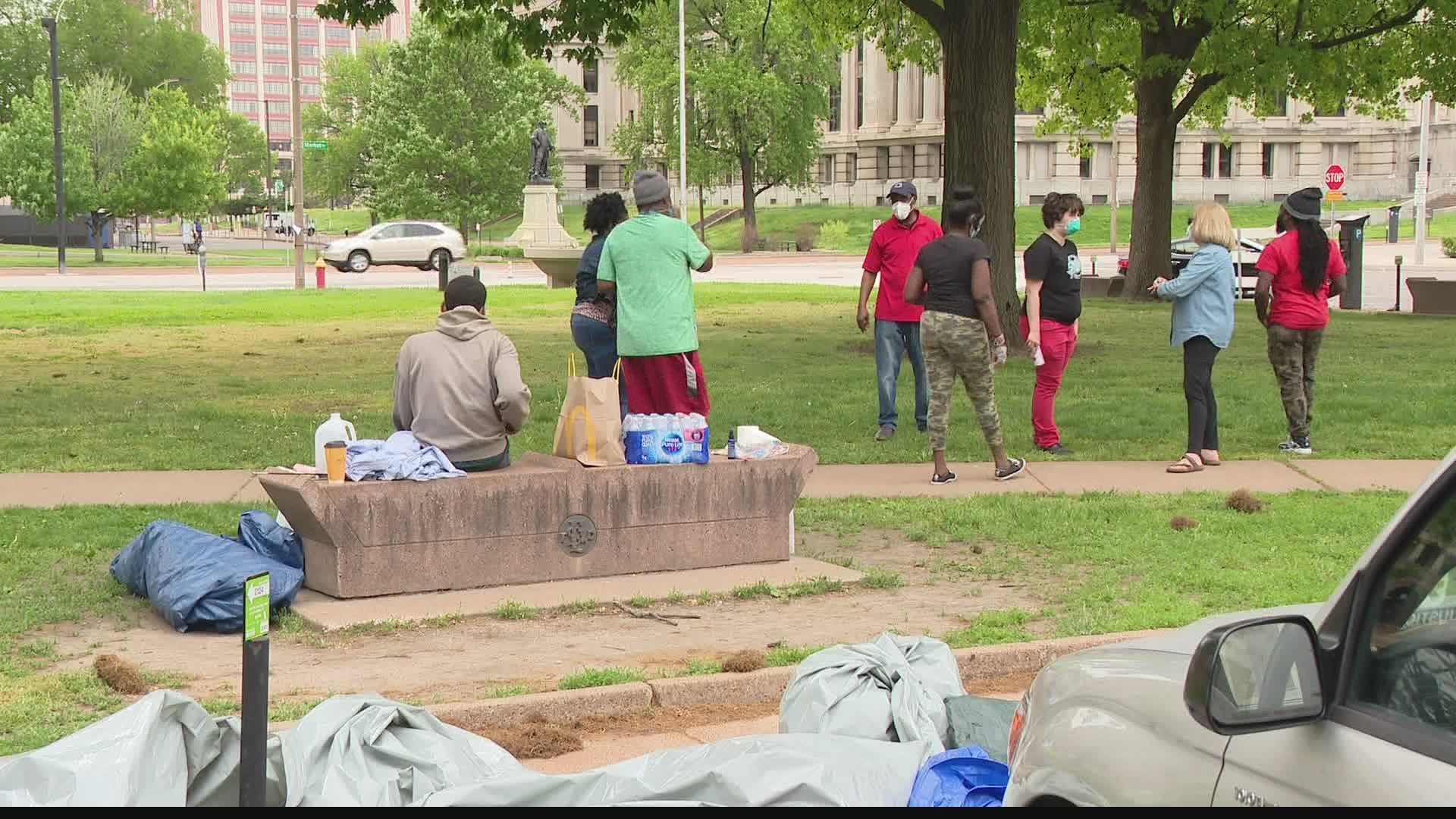 A handful of tents remained in front of St. Louis City Hall Sunday morning, with a dumpster stationed nearby