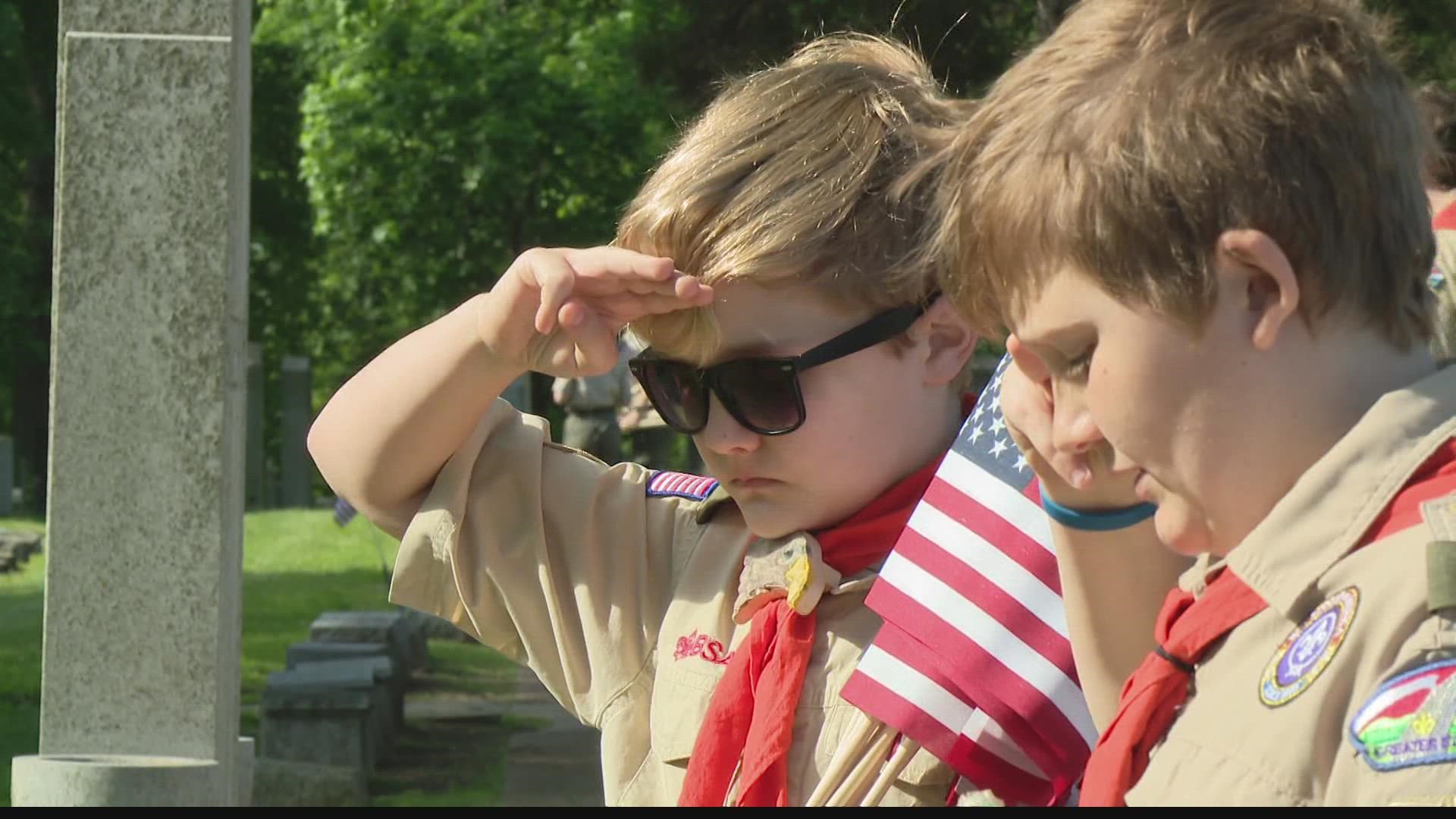 Marlborough scouts place flags on veterans' graves