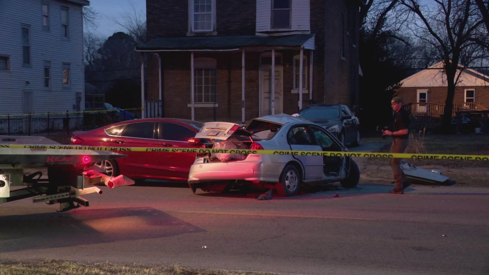 A suspect accidentally shot himself after the car he was driving crashed into another car Friday afternoon in East St. Louis, killing two people inside, police said.