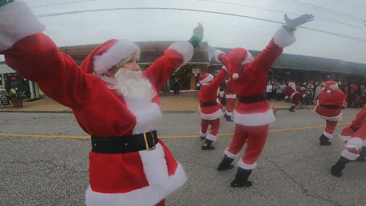 Dancing Santas spread holiday spirit through the streets of St. Louis