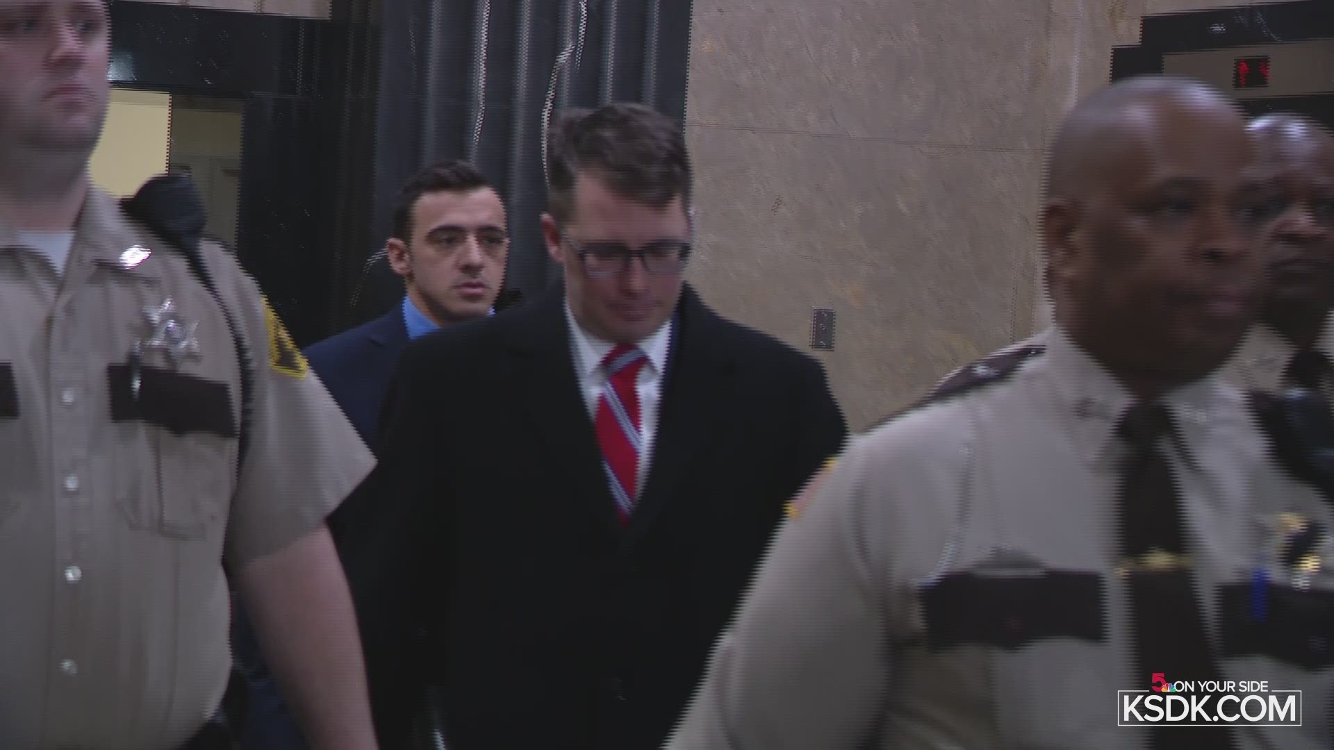 Nathaniel Hendren was surrounded by officers as he was escorted in and out of the courthouse.