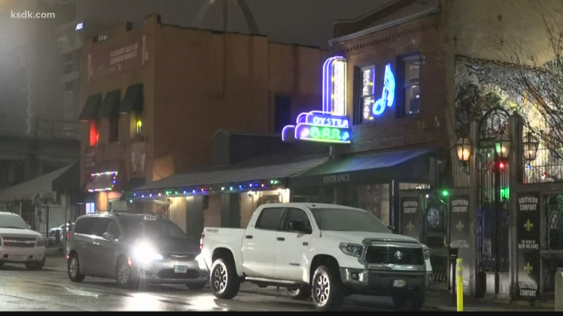 Bar patrons say they wrestled a homeless man to the ground after he stabbed a bouncer who was trying to get him to leave.