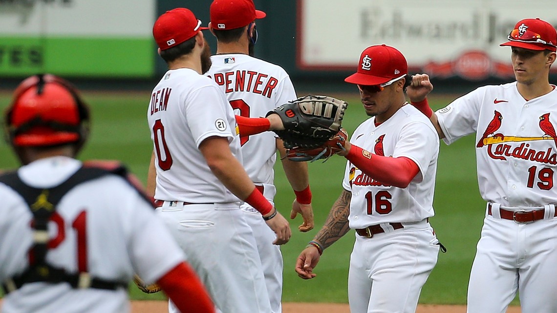 Wearing Clemente's No. 21, Molina homers for Cards in opener