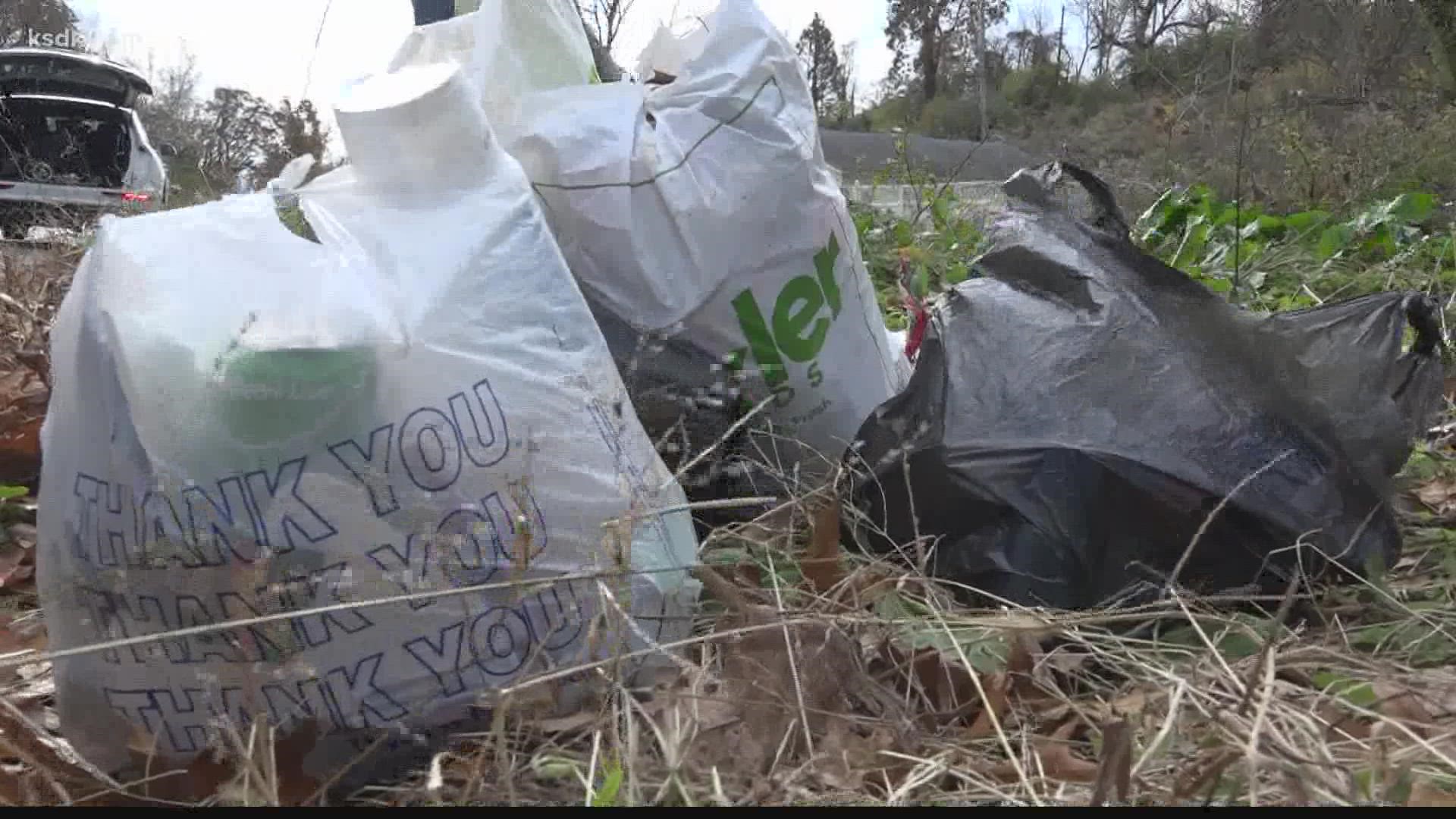 Full bags of trash can be seen scattered all along Spring Garden Drive in Riverview. Sandy White, 76, takes the time to help clean up the trash.