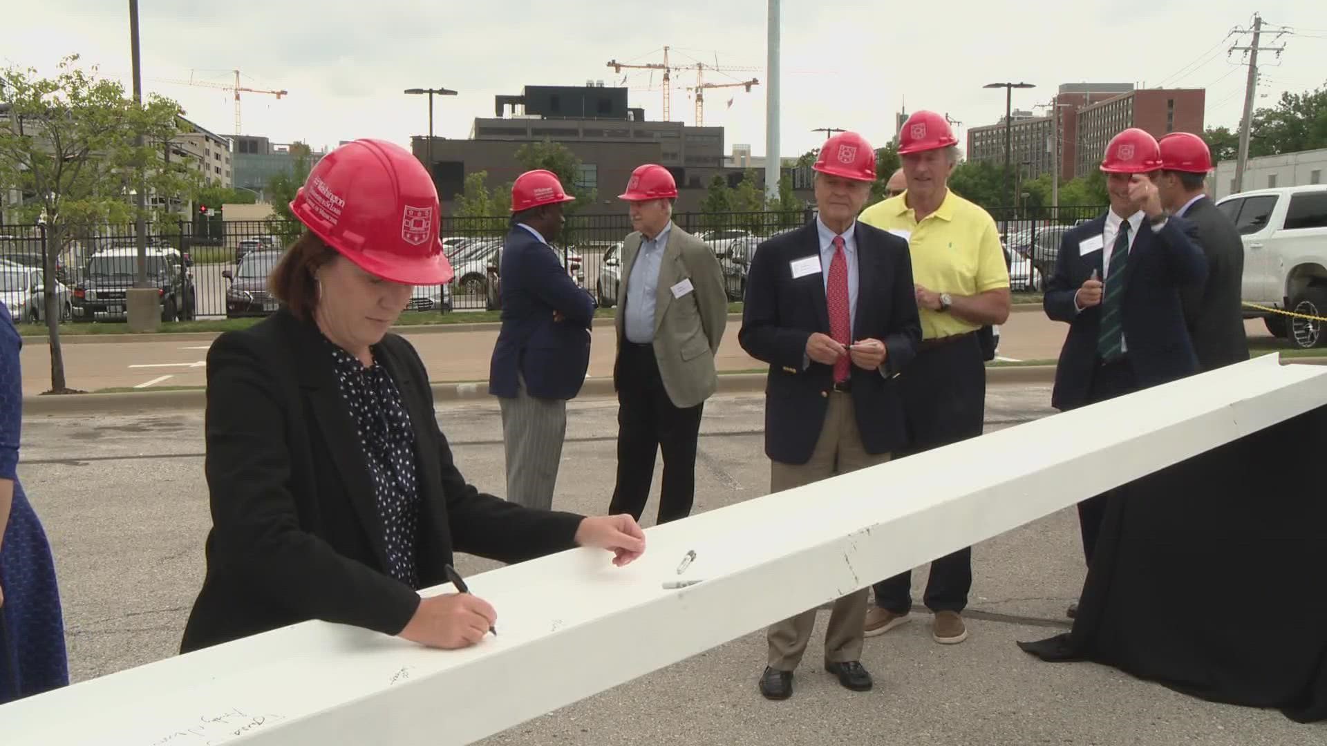 The final beam is now atop the new Neuroscience Research Building at the Washington University School of Medicine.