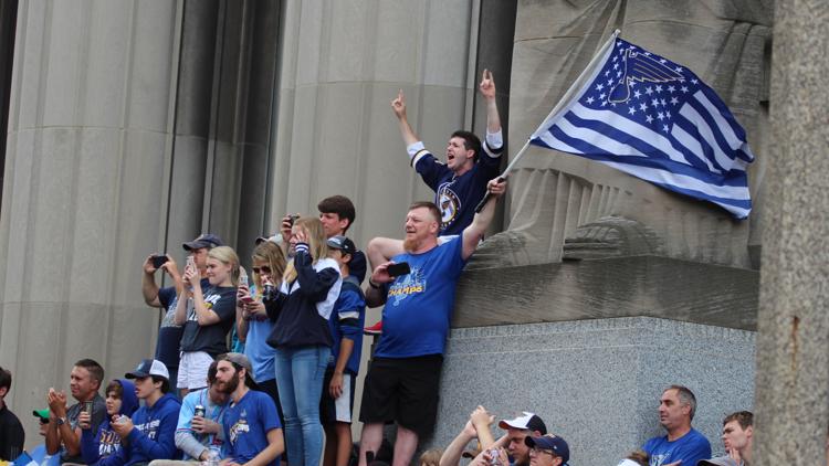 The moment Pat Maroon put a baby in the Cup during the Blues parade