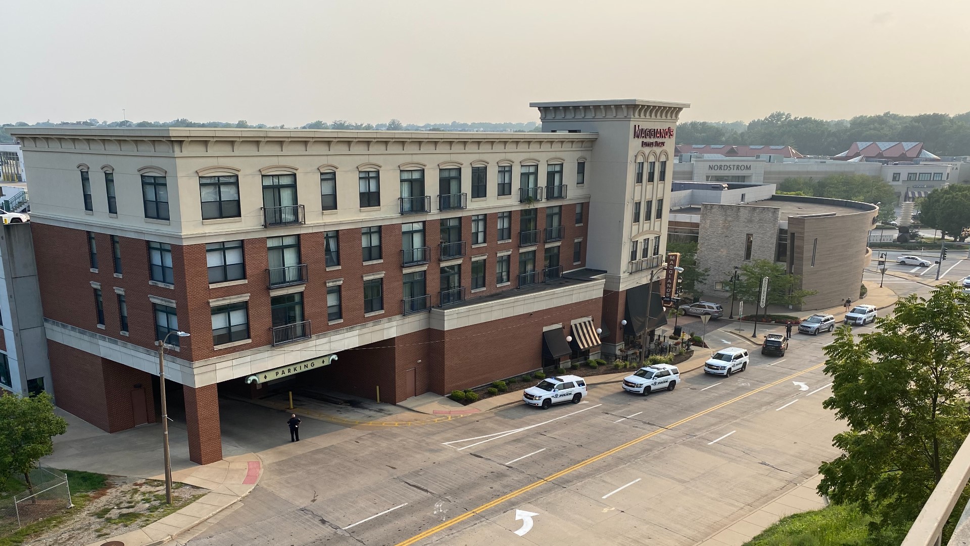 Witnesses reported a male suspect was carrying a rifle and ran into the parking garage of The Boulevard, which is home to several retail stores and restaurants