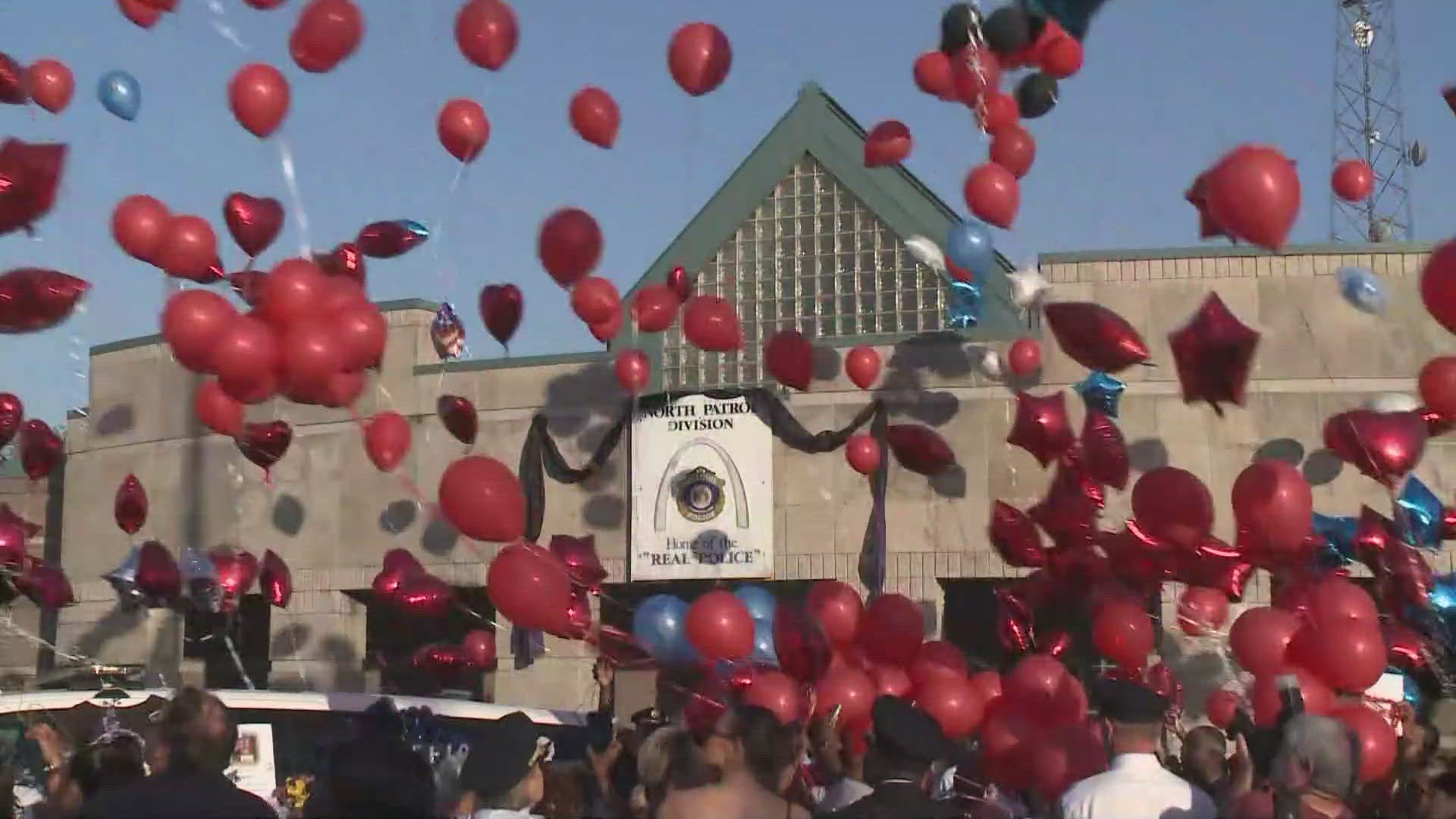 Red balloons were released in honor of Officer David Lee ahead of his funeral on Saturday. Red was Officer Lee's favorite color.