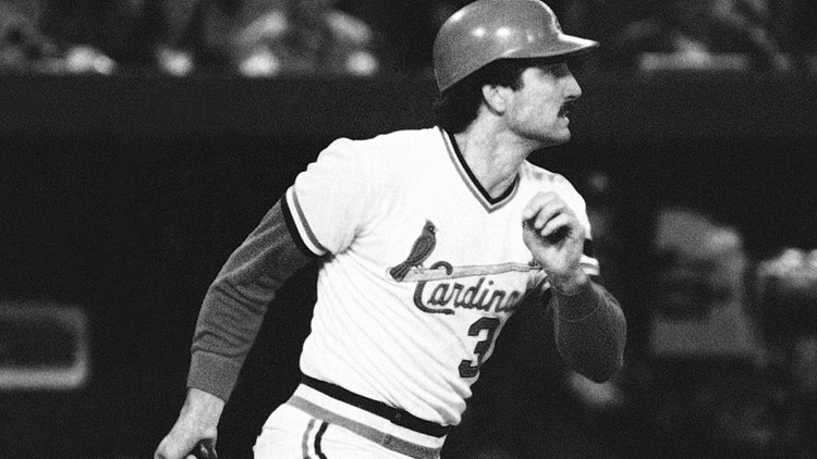 Former St. Louis Cardinals first baseman Keith Hernandez gets a ride from  the Cardinals mascot Fredbird before pulling down the number 36 off of the  Busch Stadium rightfield wall during a game