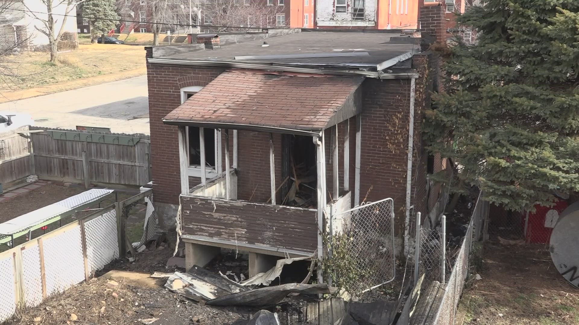 A family was forced out of their home after a fire at a vacant building jumped onto their home. The family was safe due to passersby's quick thinking.