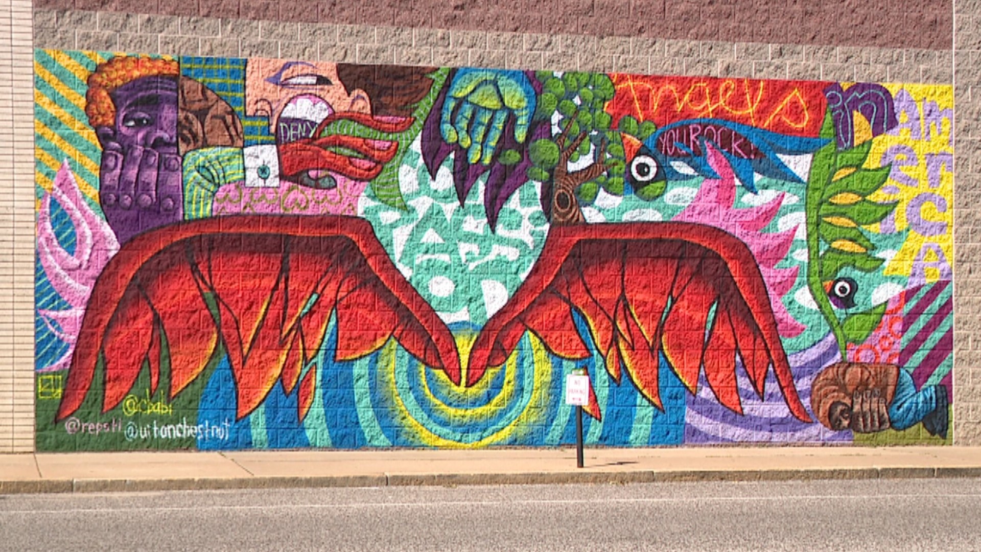 Angel wings street art unveiled outside St. Louis brewery
