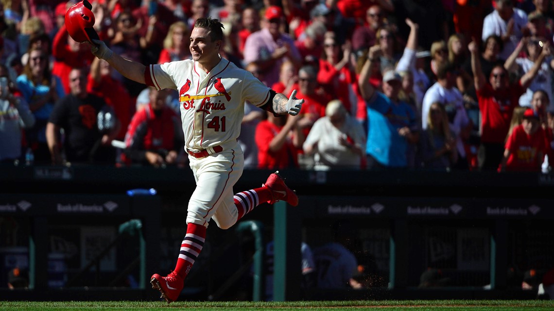 St. Louis Cardinals teammates rip the jersey from the back of Tyler O'Neill  (L) after O'Neill hit a walk off home run against the San Francisco Giants  in the tenth inning at