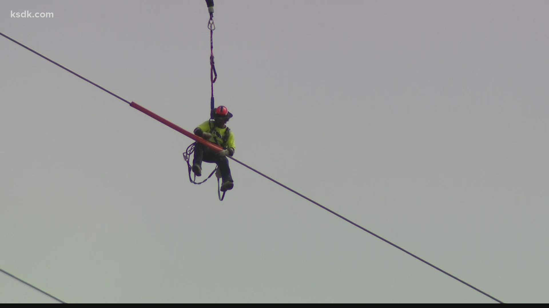 Ameren utilized aerial linemen to stretch cables from Missouri to Illinois.