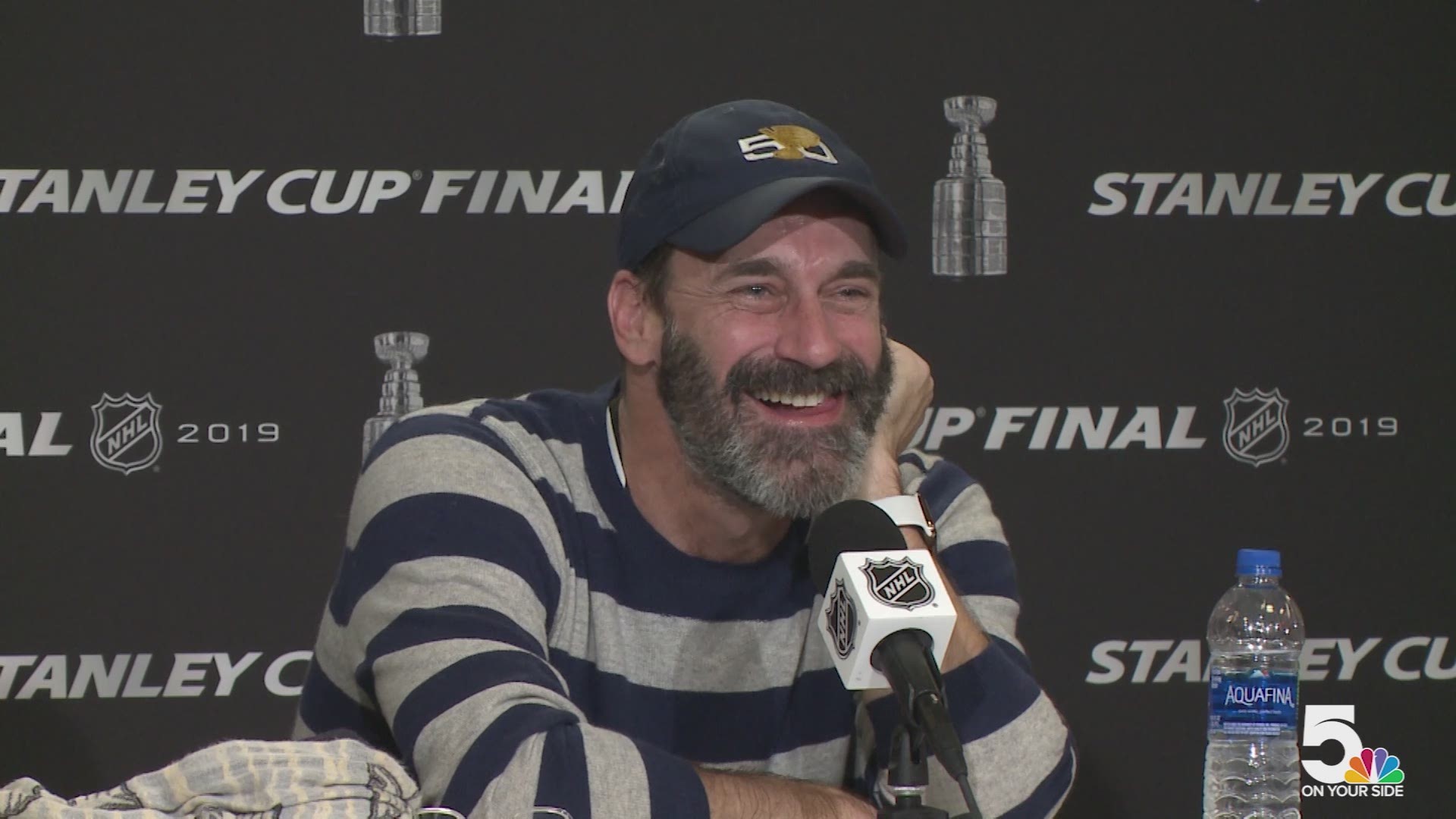 Jon Hamm sports his St. Louis Blues hat while he heads out for