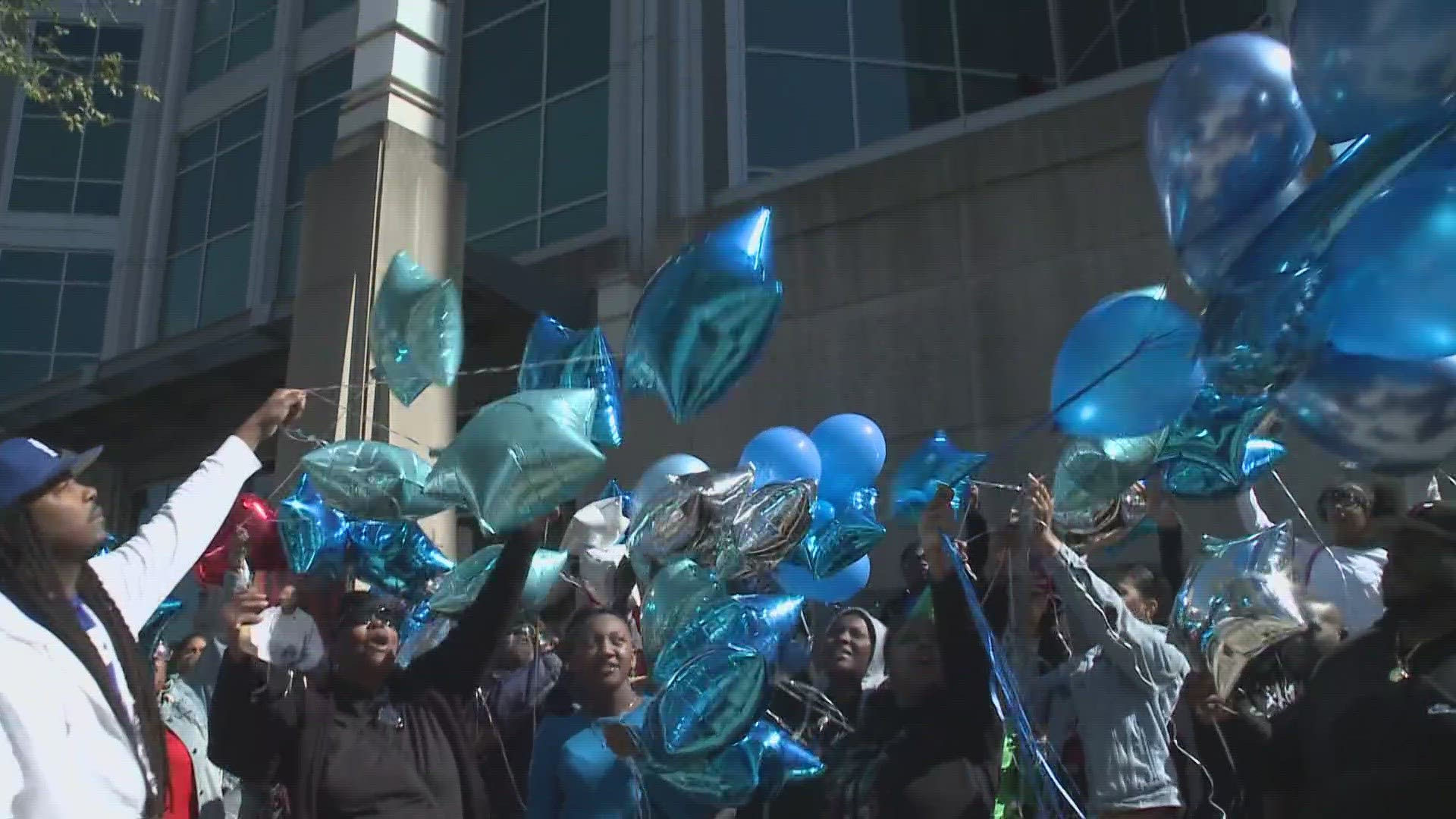 Friends and family of Juwon Carter held a balloon release outside of the City Justice Center on Saturday. Carter suffered a medical emergency while in custody.