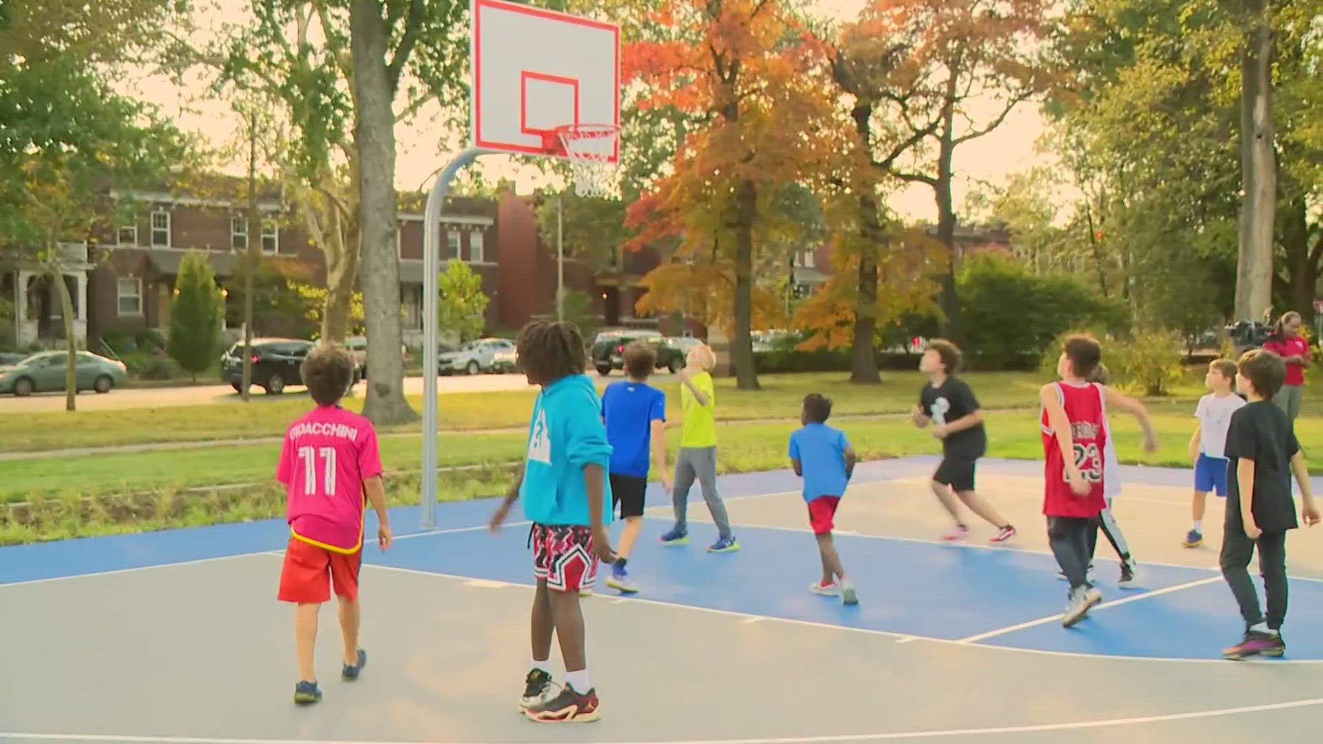 Children played Friday at two new basketball courts in Tower Grove Park. St. Louis removed courts in the 1980s because of crime concerns.