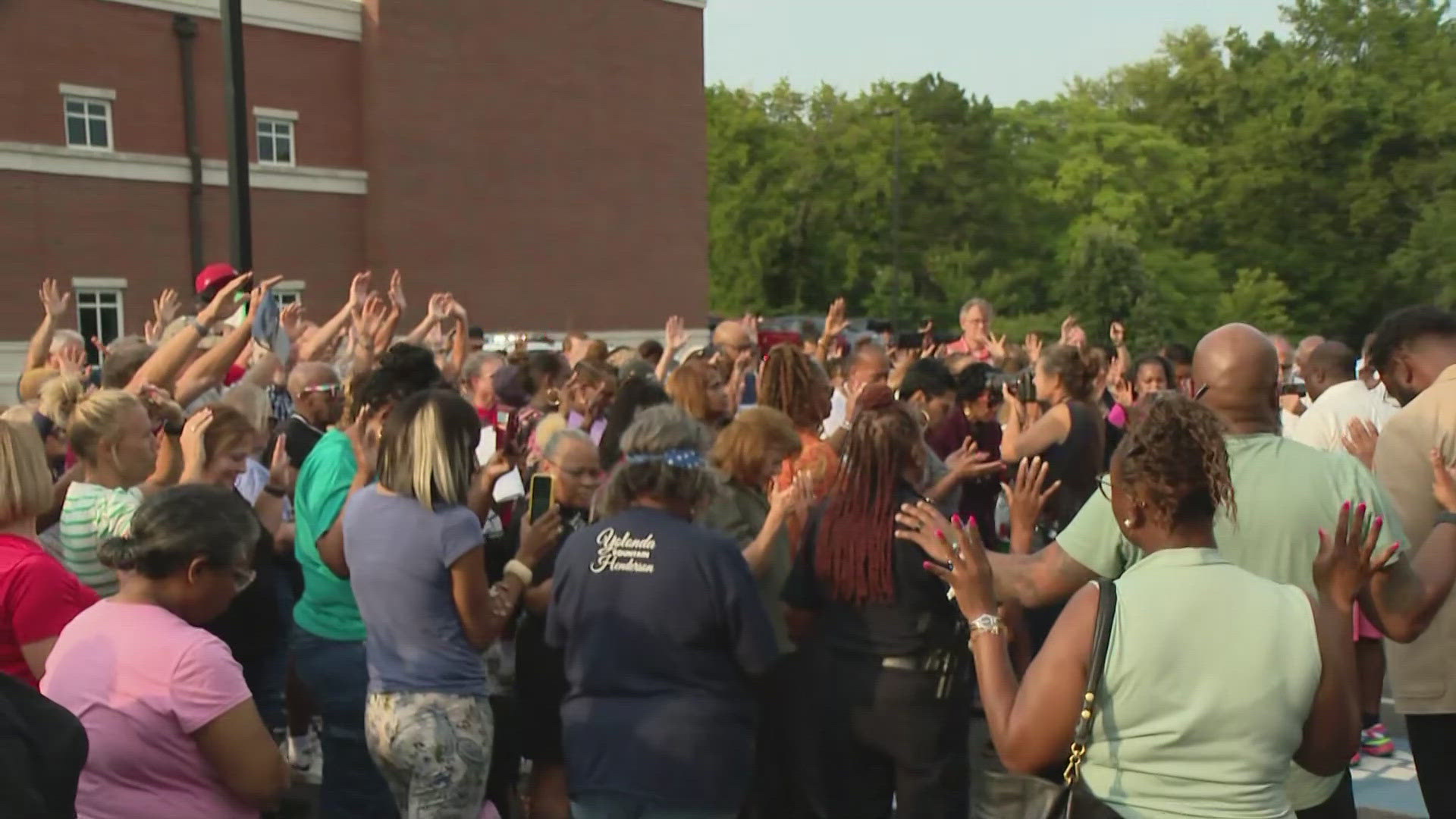 Officer Travis Brown is still hospitalized after being seriously hurt in a Friday night protest. Several hundred were also at a vigil today in support.