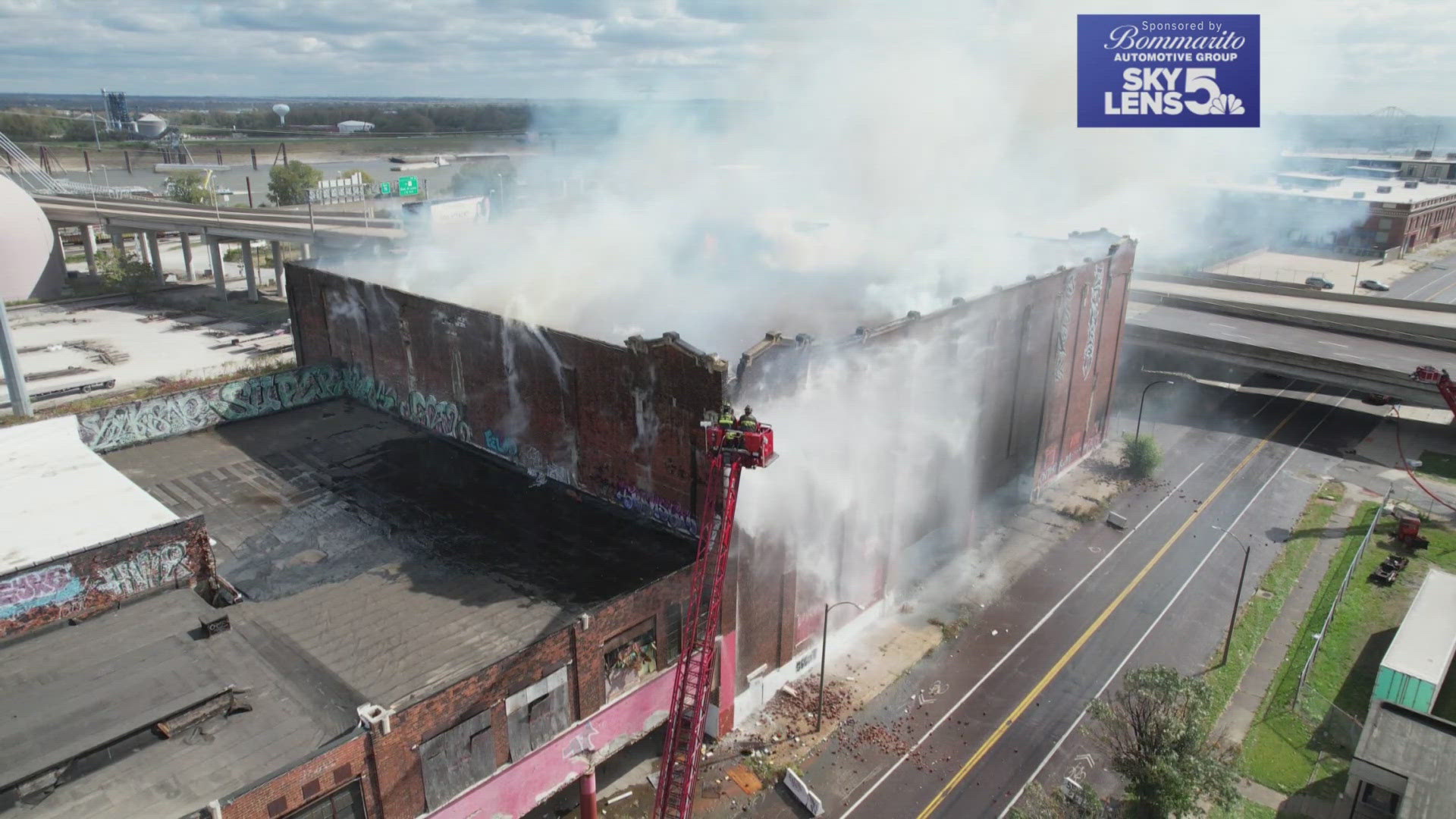 MoDOT says the Stan Musial Bridge closure could take longer than expected. The building is still smoldering Wednesday after starting Monday afternoon.