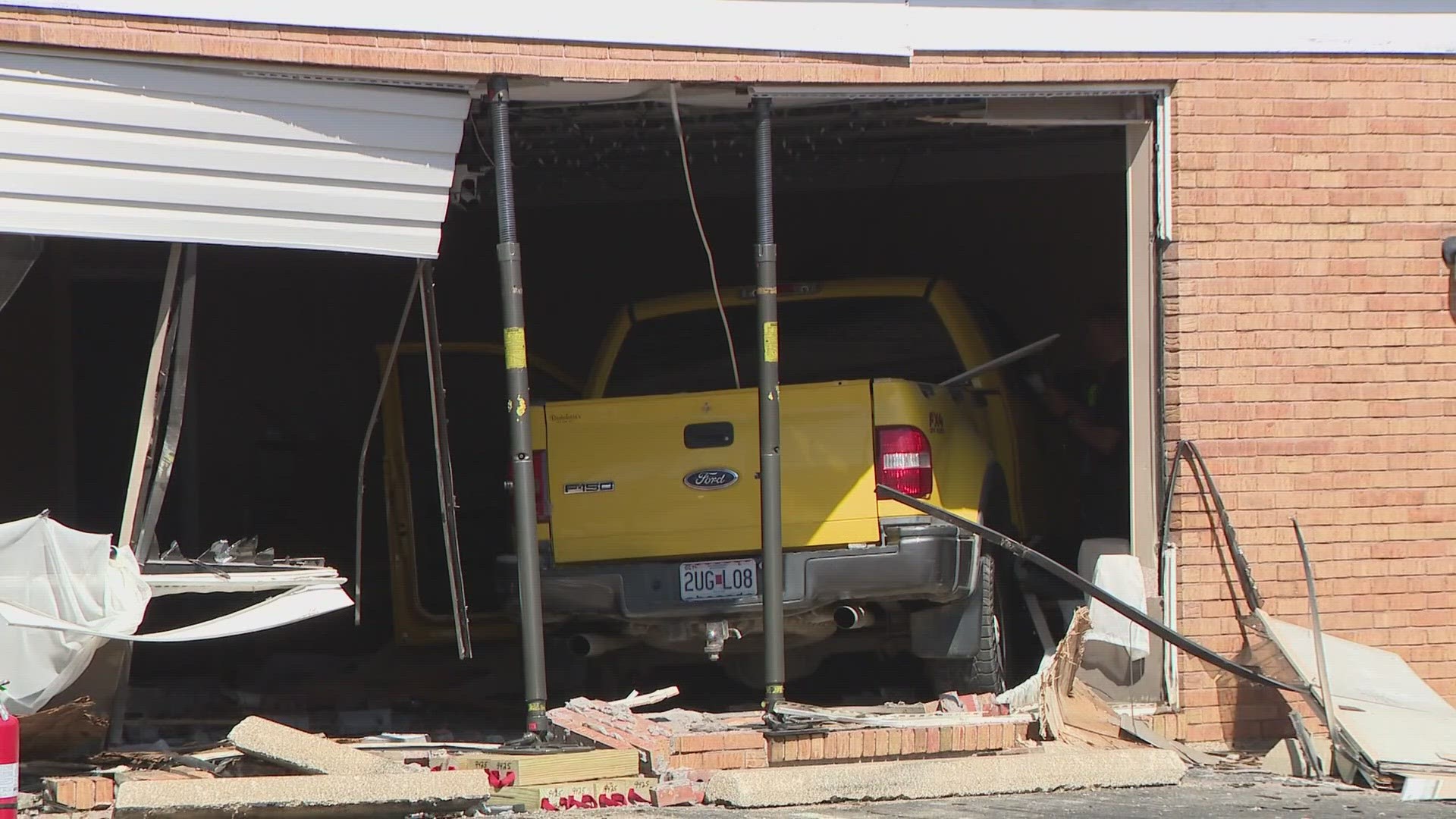 A yellow pickup truck was crashed into the Emerson Unitarian Universalist Chapel and Community building near the intersection of N 5th Street and Jefferson Street.