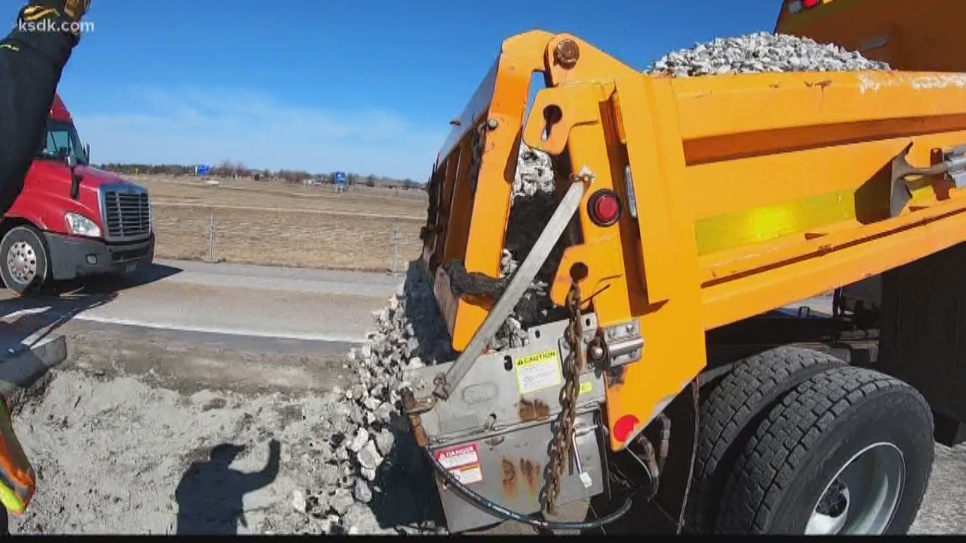 With nice weather Thursday, road crews filled potholes ahead of Friday's snow.