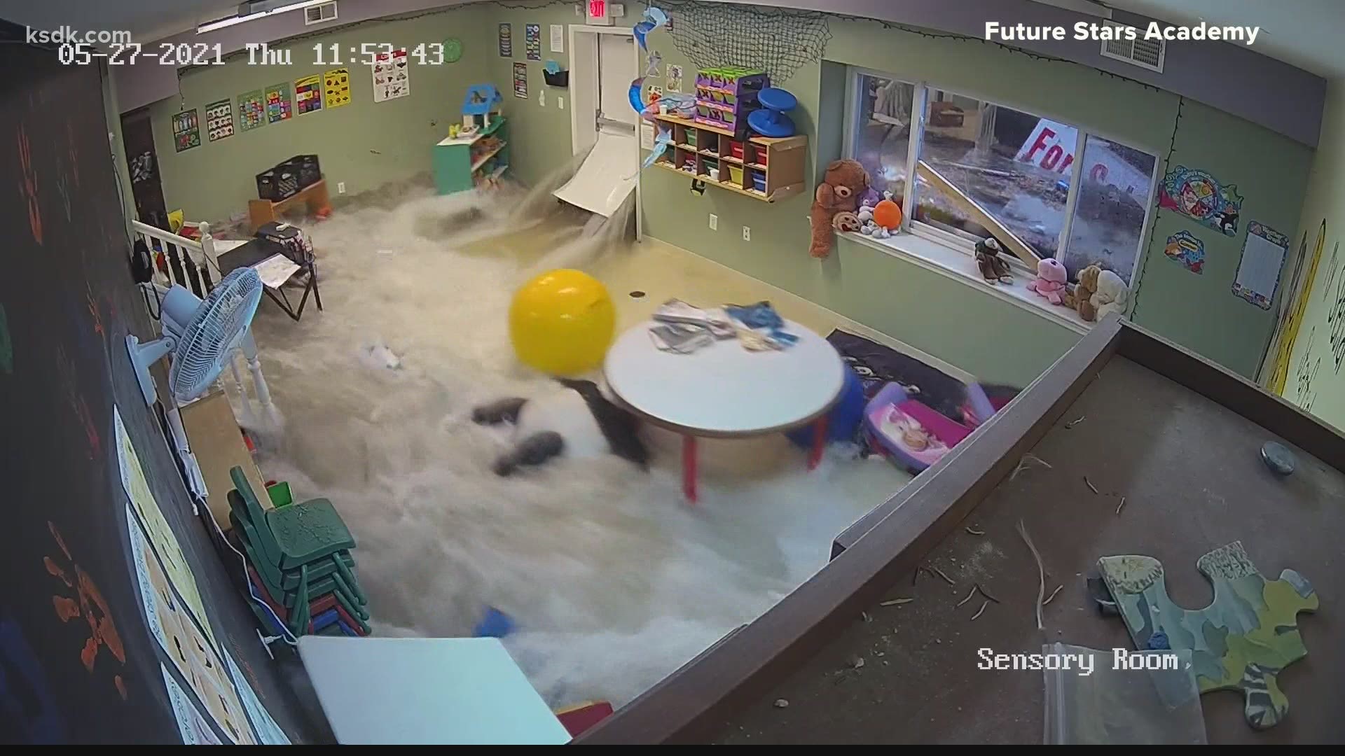 When flooding pushed in a door on May 27, a security video captured how quickly the water rushed into an empty playroom, taking all the furniture and toys with it.