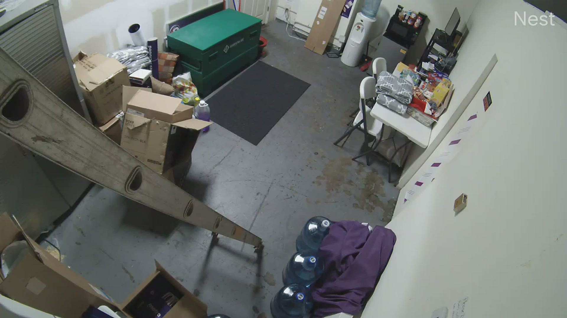 This video shows three of the looters going through the back room of the store.