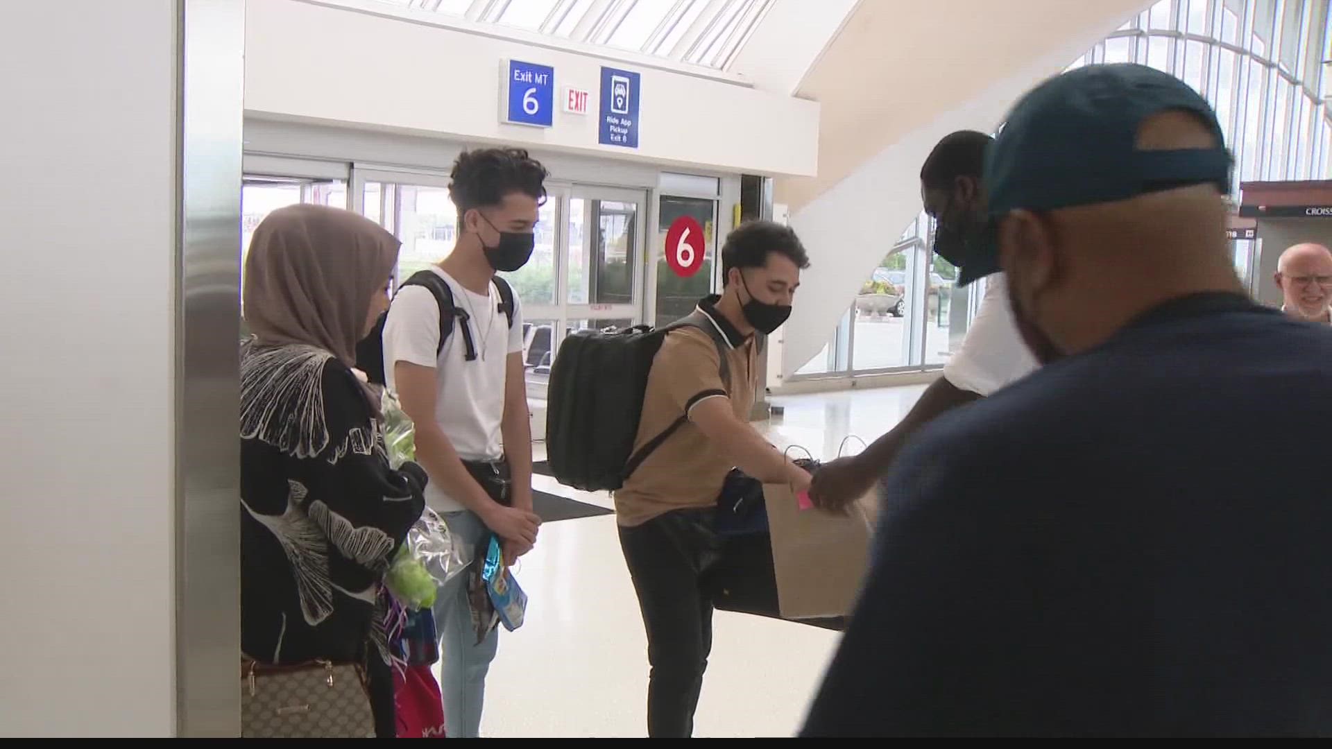 The Azimi family flew into Lambert International Airport after being stranded in the country of Albania.