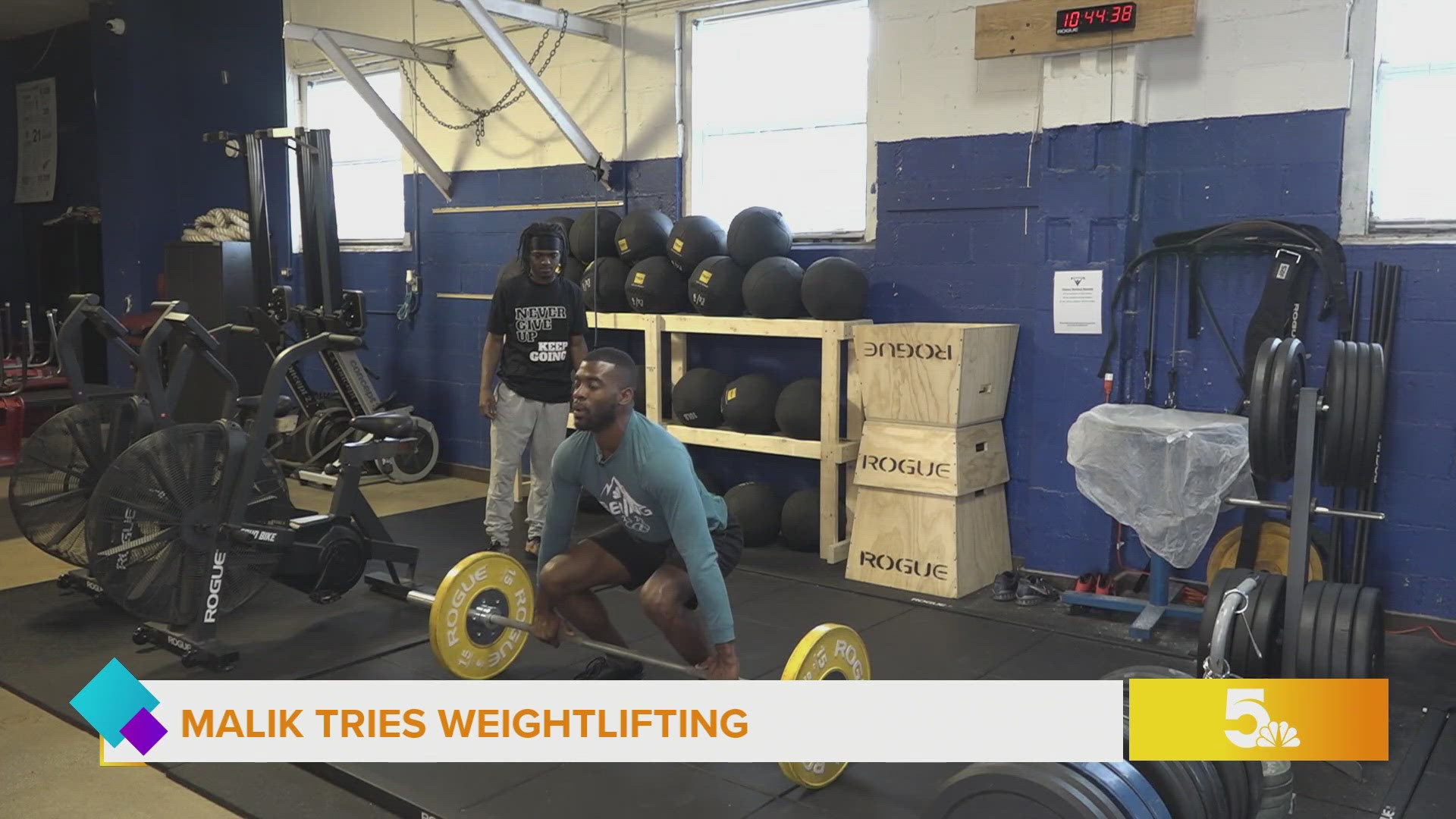 Malik works his muscles as he tries weightlifting in today's It's Harder Than it Looks Series.