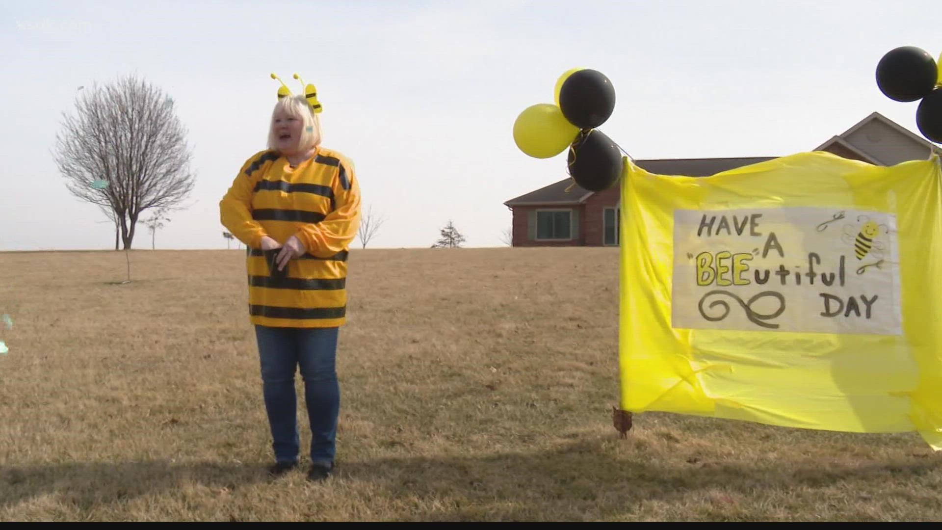 Dana Hottenrott dresses up in fun costumes and makes signs with words of encouragement for five of her grandchildren who ride the bus to and from school.