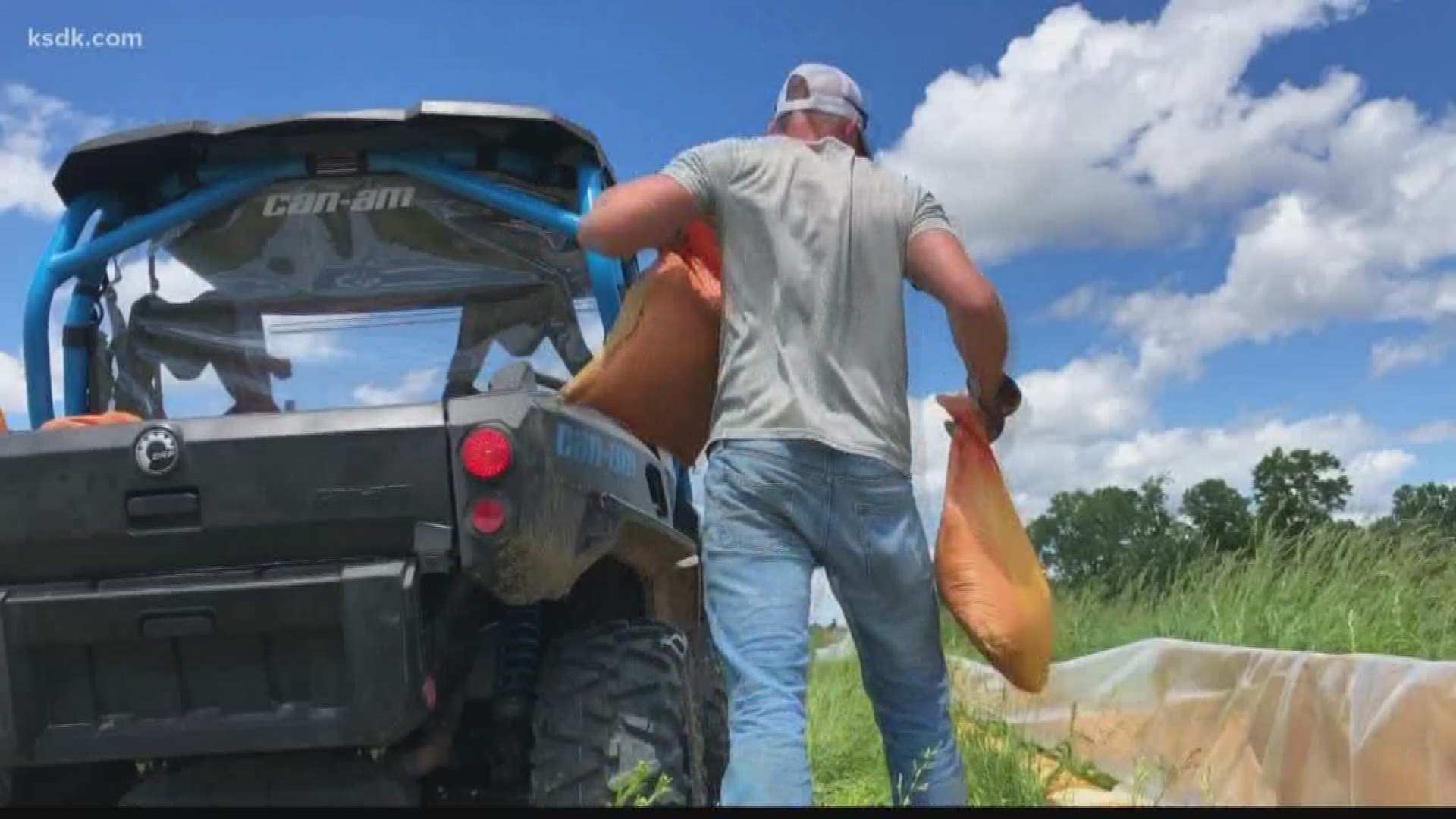 People from as far away as Colorado made the trip to Winfield to help bolster the levee.