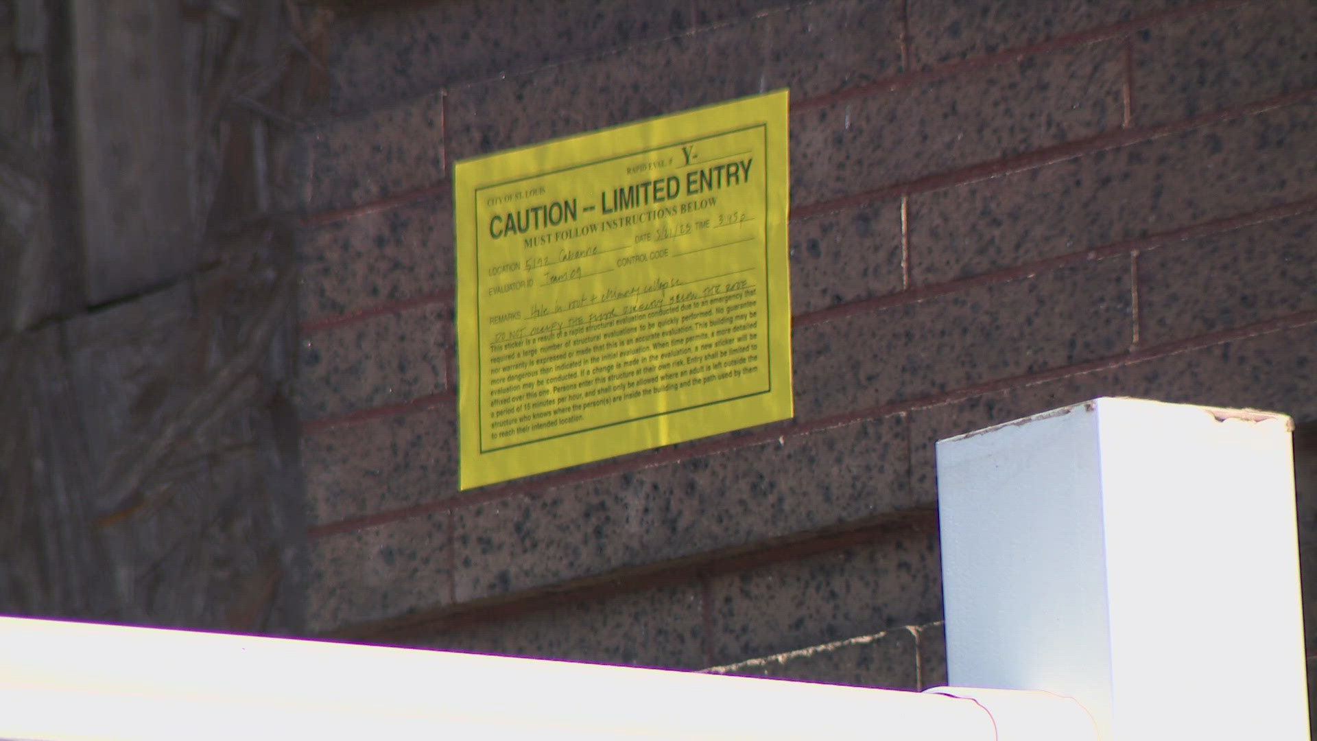 The city is using colored notices to indicate the structural safety of buildings. The signs do not mean certain buildings are being condemned.
