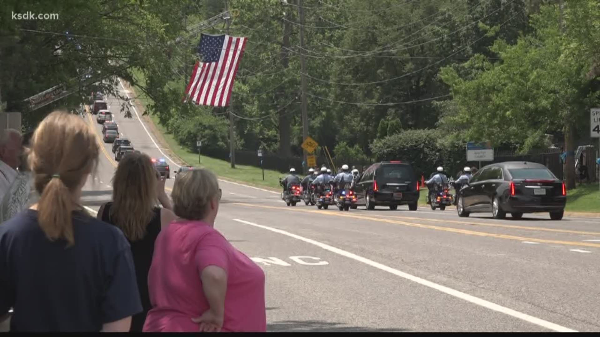 Thousands of people lined the streets as Officer Michael Langsdorf was taken to his final resting place.