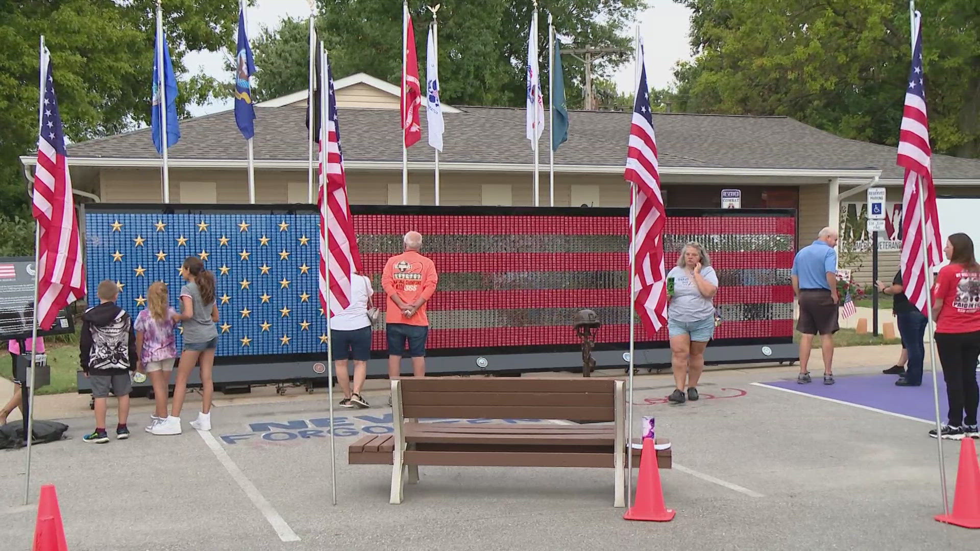 The Fallen Heroes Memorial features the dog tags of 7,040 fallen soldiers and 50 gold stars in honor of their family members, creating the image of an American flag.