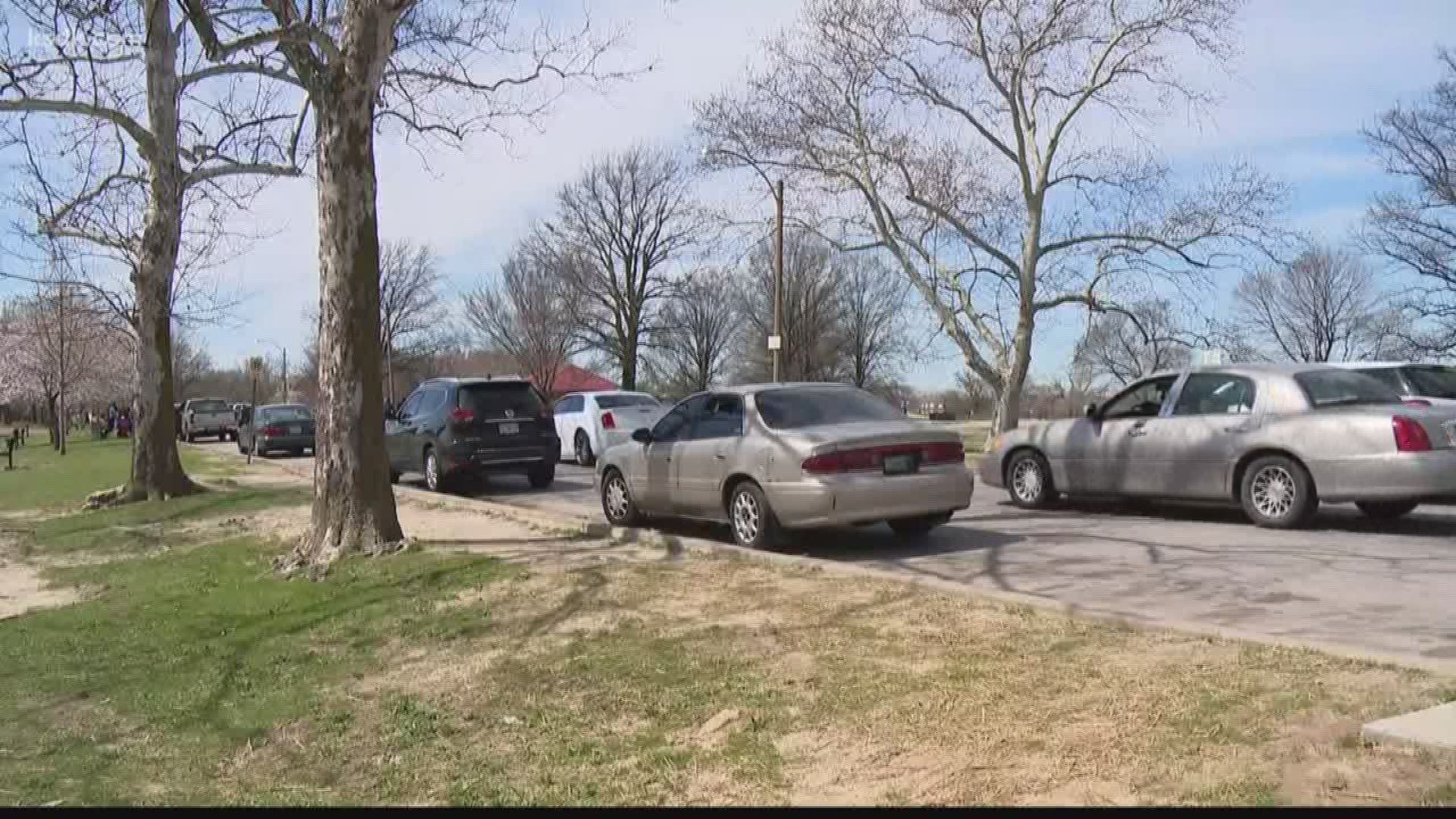 Social media posts show hundreds of cars lining the street in O'Fallon Park, people standing side by side. Another immediate concern: reports of guns and gunfire.